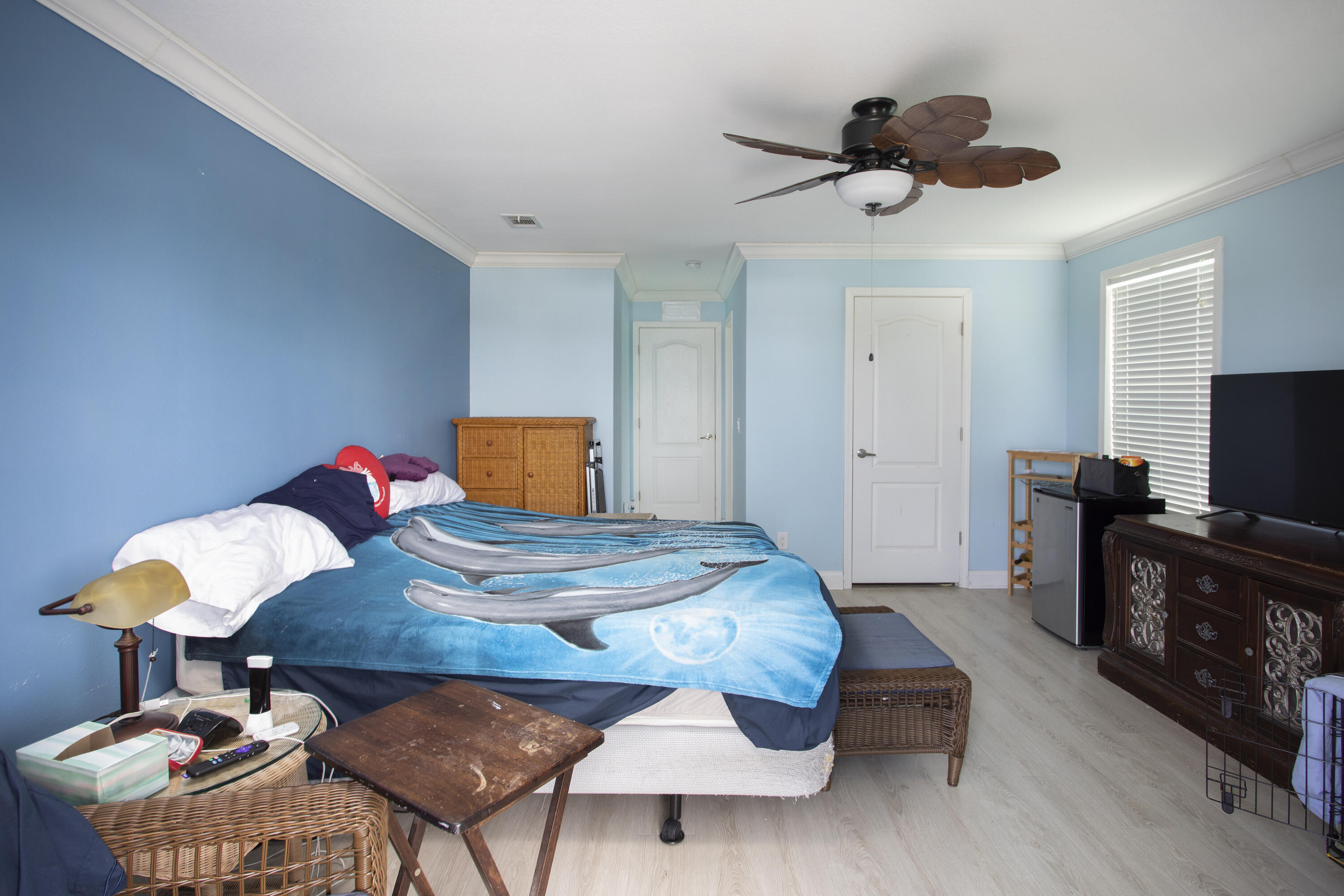 59 Palm Drive Key West, FL 33040 - Photo 8 of 14 a bedroom with a bed and wooden floor