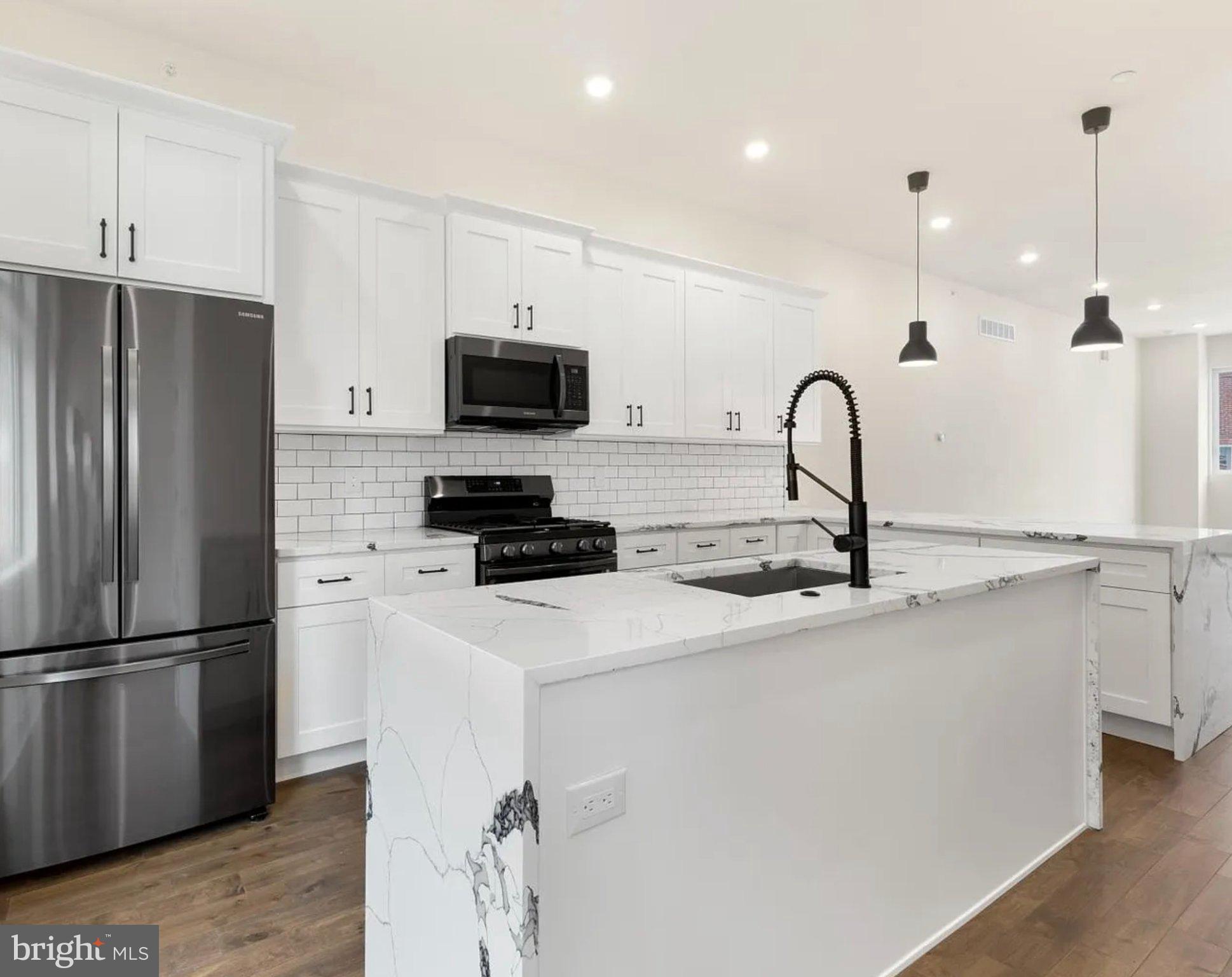 2719 Lefevre Street Philadelphia, PA 19137 - Photo 7 of 33 Sleek modern kitchen with elegant finishes.