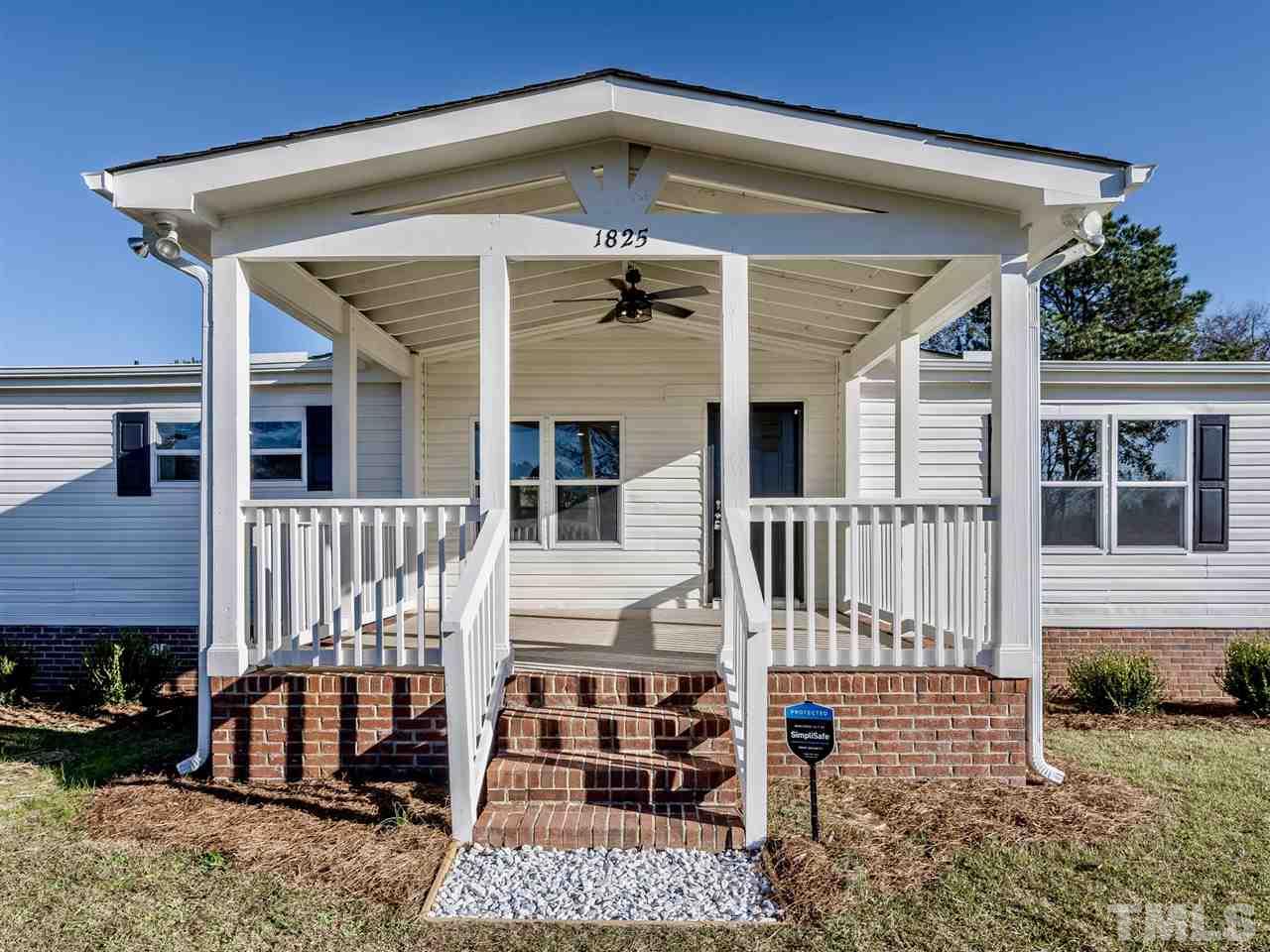 1825 Wire Road Bunnlevel, NC 28323 - Photo 1 of 30 2.4 ACRES! Gorgeous land and like new home with all the bells and whistles! New front porch, brand new windows, brand new roof, state of the art security system, 3 bedroom, 2 bath, secluded lot minutes from Lillington! NO WATER BILL!!
