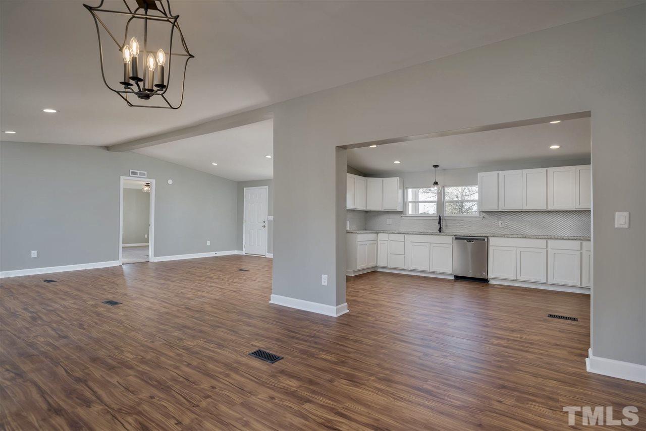 1825 Wire Road Bunnlevel, NC 28323 - Photo 29 of 30 Brand new waterproof luxury vinyl tile floors with warranty will make living life in this open floor plan so much easier!