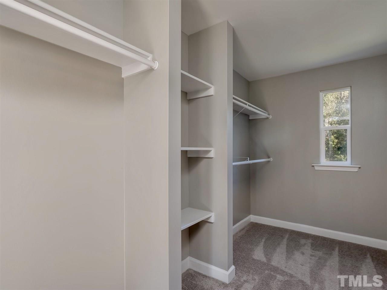 1825 Wire Road Bunnlevel, NC 28323 - Photo 16 of 30 This custom closet was designed and built by a local woodworker. Huge closet boasts brand new carpet and its own special window!
