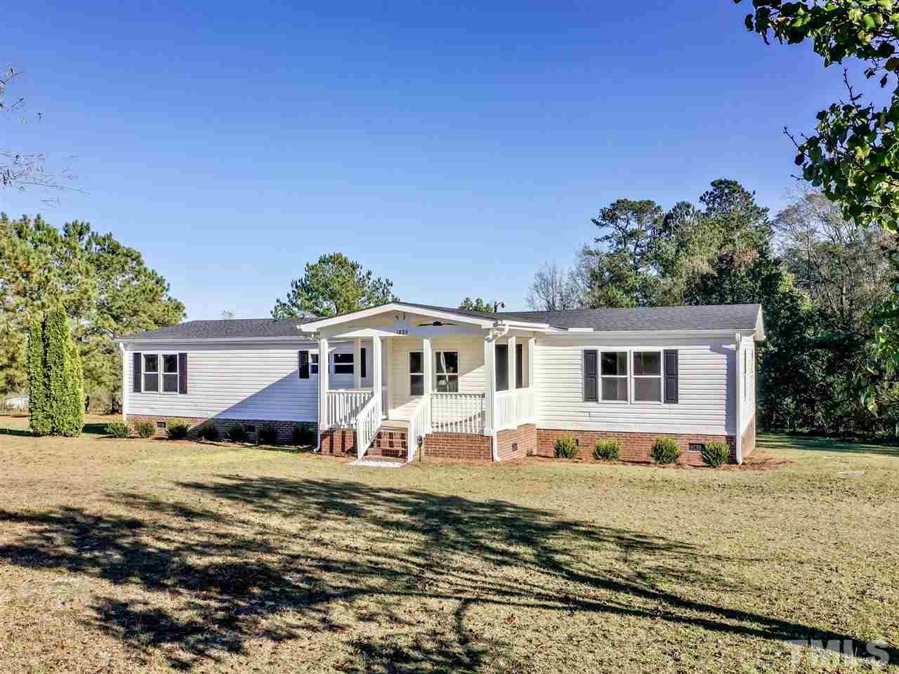 1825 Wire Road Bunnlevel, NC 28323 - Photo 3 of 30 New landscaping and spacious private lot make this deal to sweet to pass up!