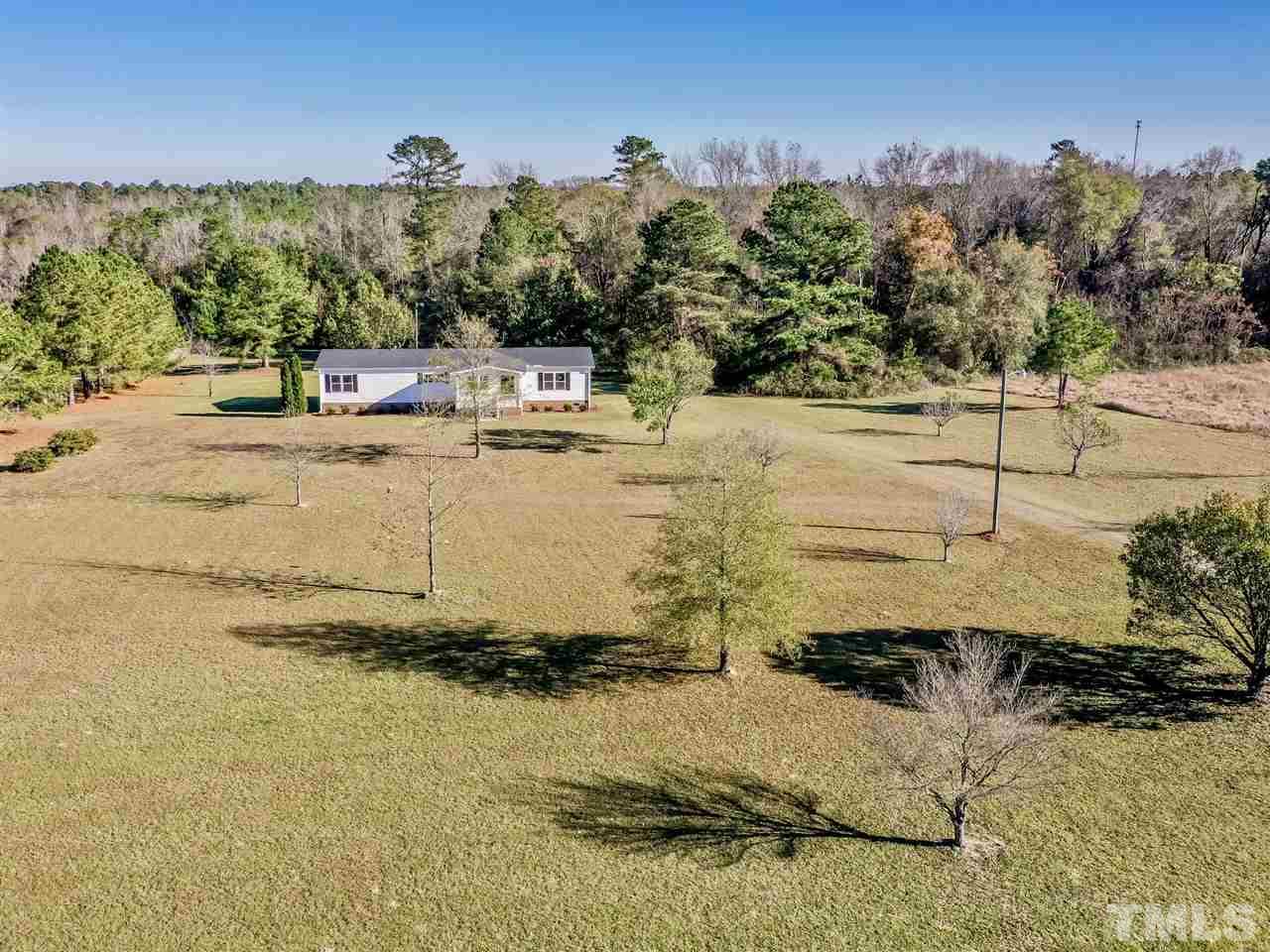 1825 Wire Road Bunnlevel, NC 28323 - Photo 4 of 30 Beautiful pasture like land is perfect for horses, cows, big rig parking, fire pits, additions, out buildings and whatever else your heart desires!