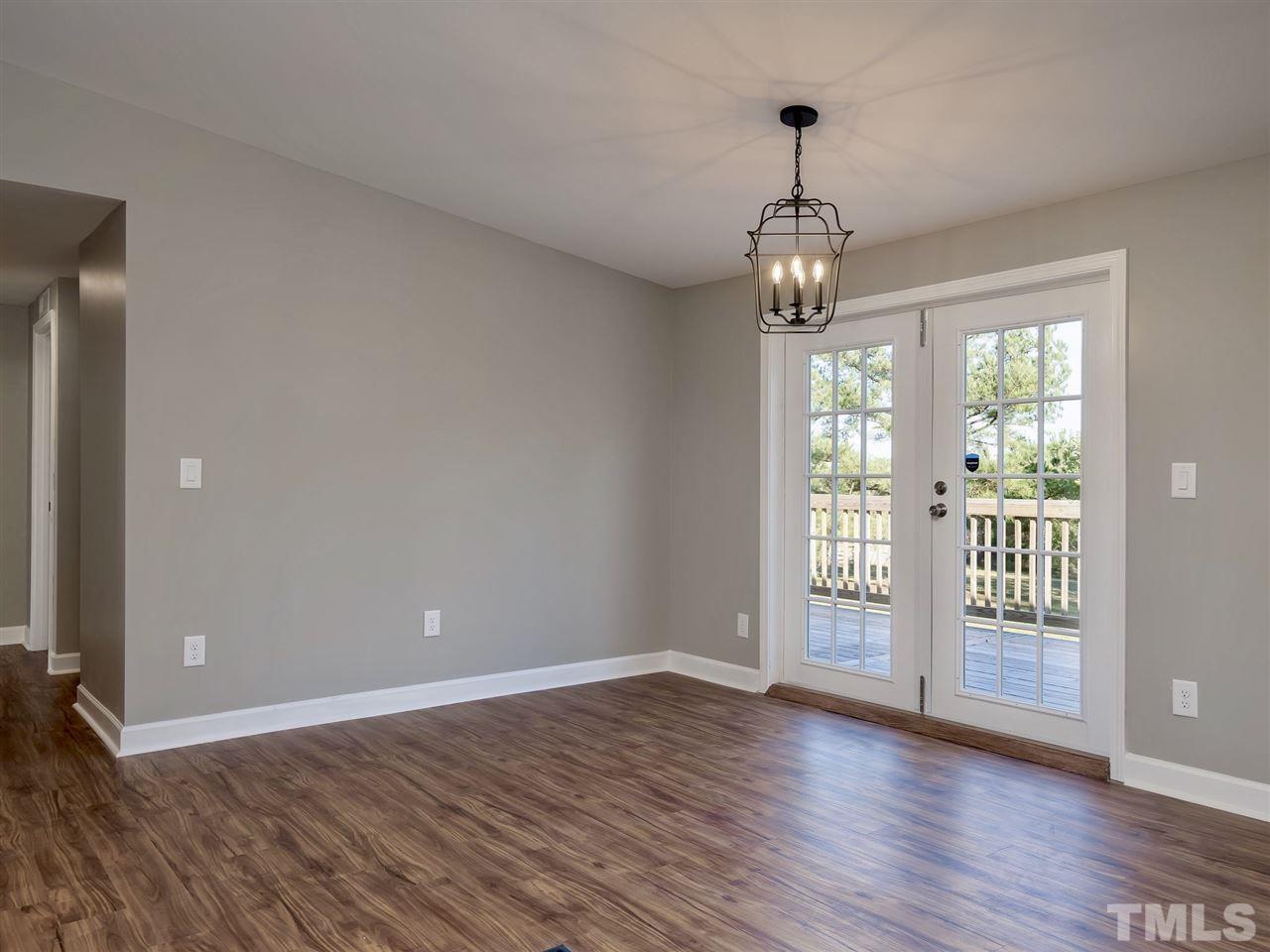 1825 Wire Road Bunnlevel, NC 28323 - Photo 28 of 30 Separate dining room and amazing open floor plan with custom lighting and brand new french doors leading to brand new deck in backyard!
