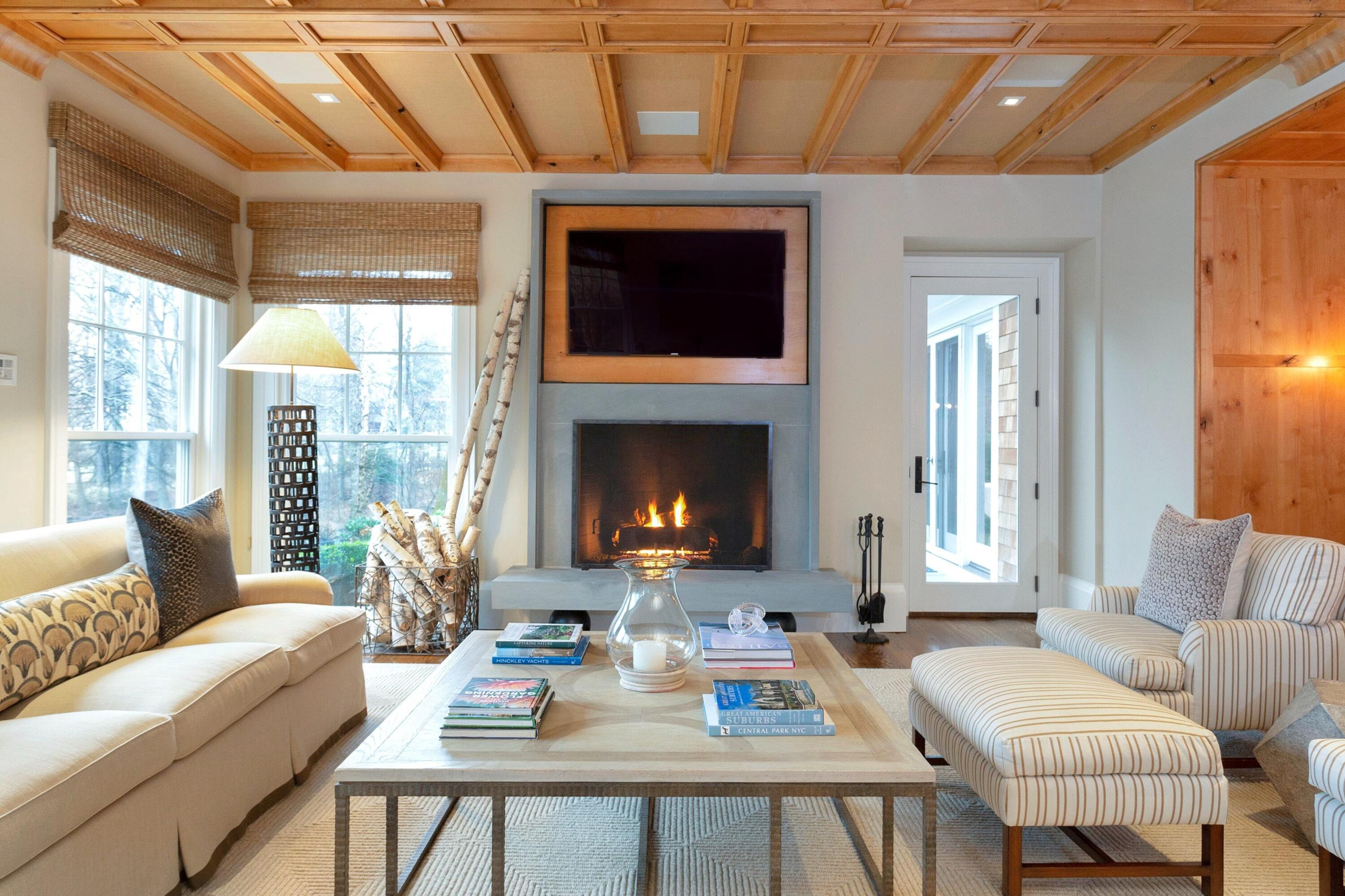 20 Driftway Lane Darien, CT 06820 - Photo 13 of 76 a living room with furniture a fireplace and a table