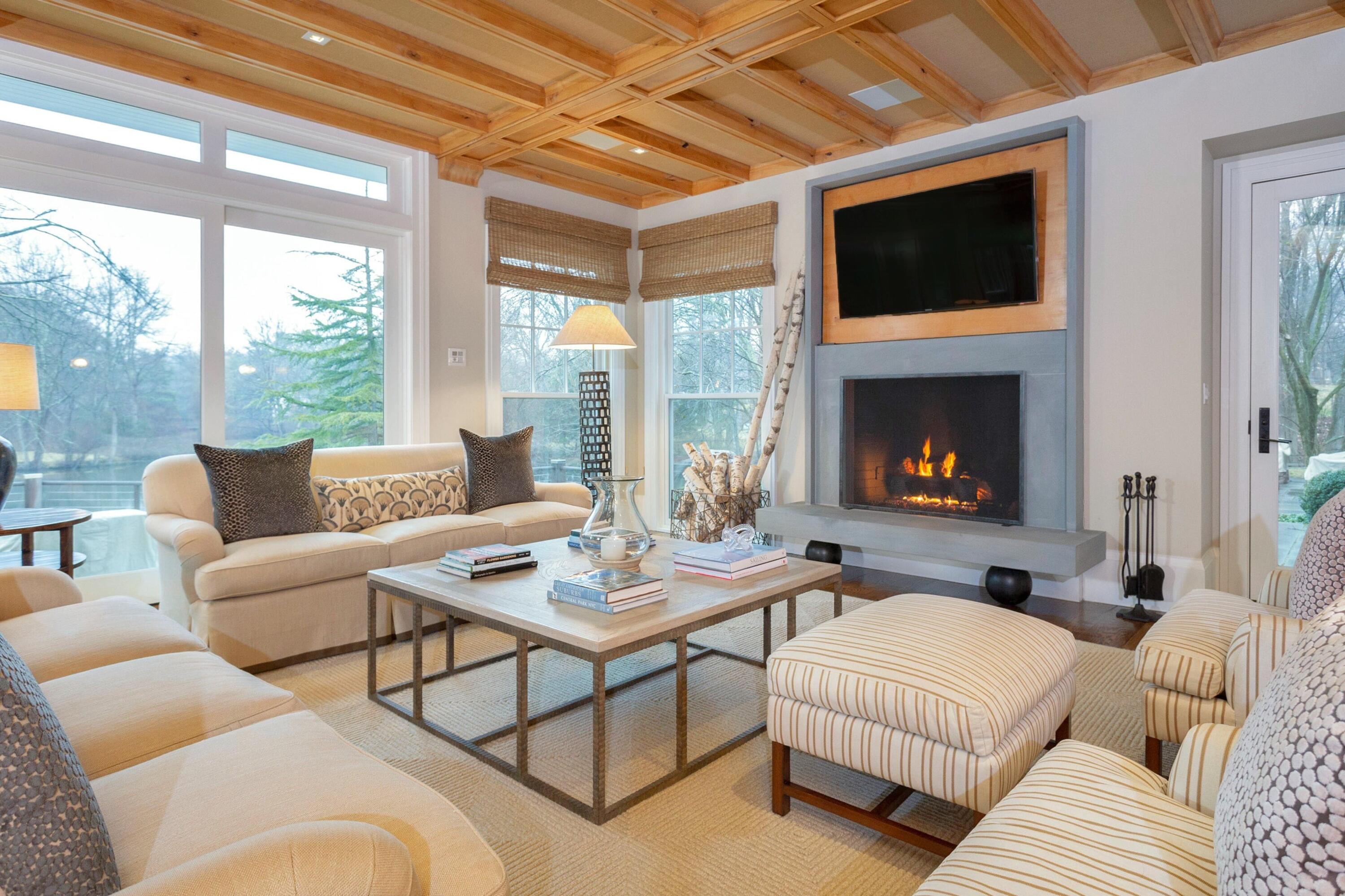 20 Driftway Lane Darien, CT 06820 - Photo 16 of 76 a living room with furniture a fireplace and a flat screen tv