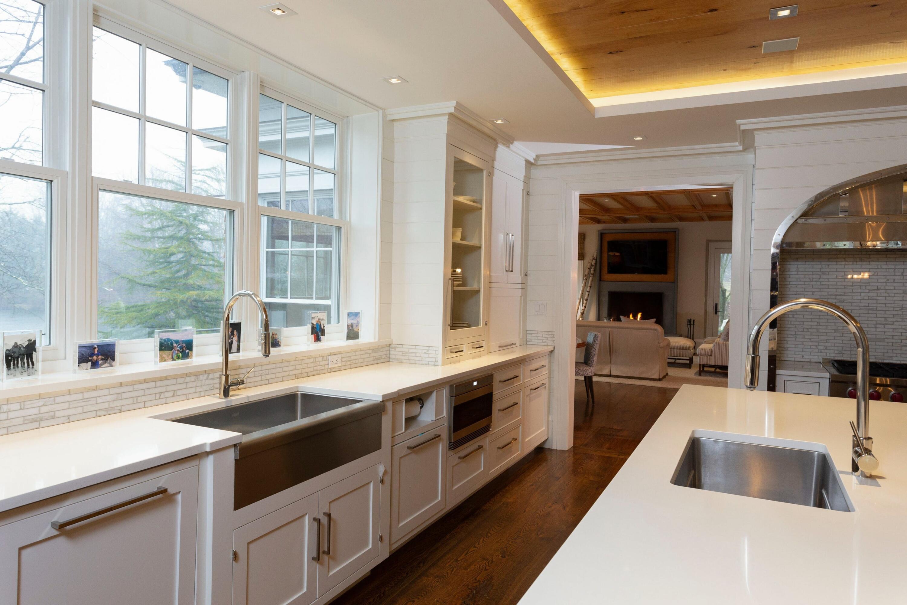 20 Driftway Lane Darien, CT 06820 - Photo 19 of 76 a large white kitchen with a sink and large window