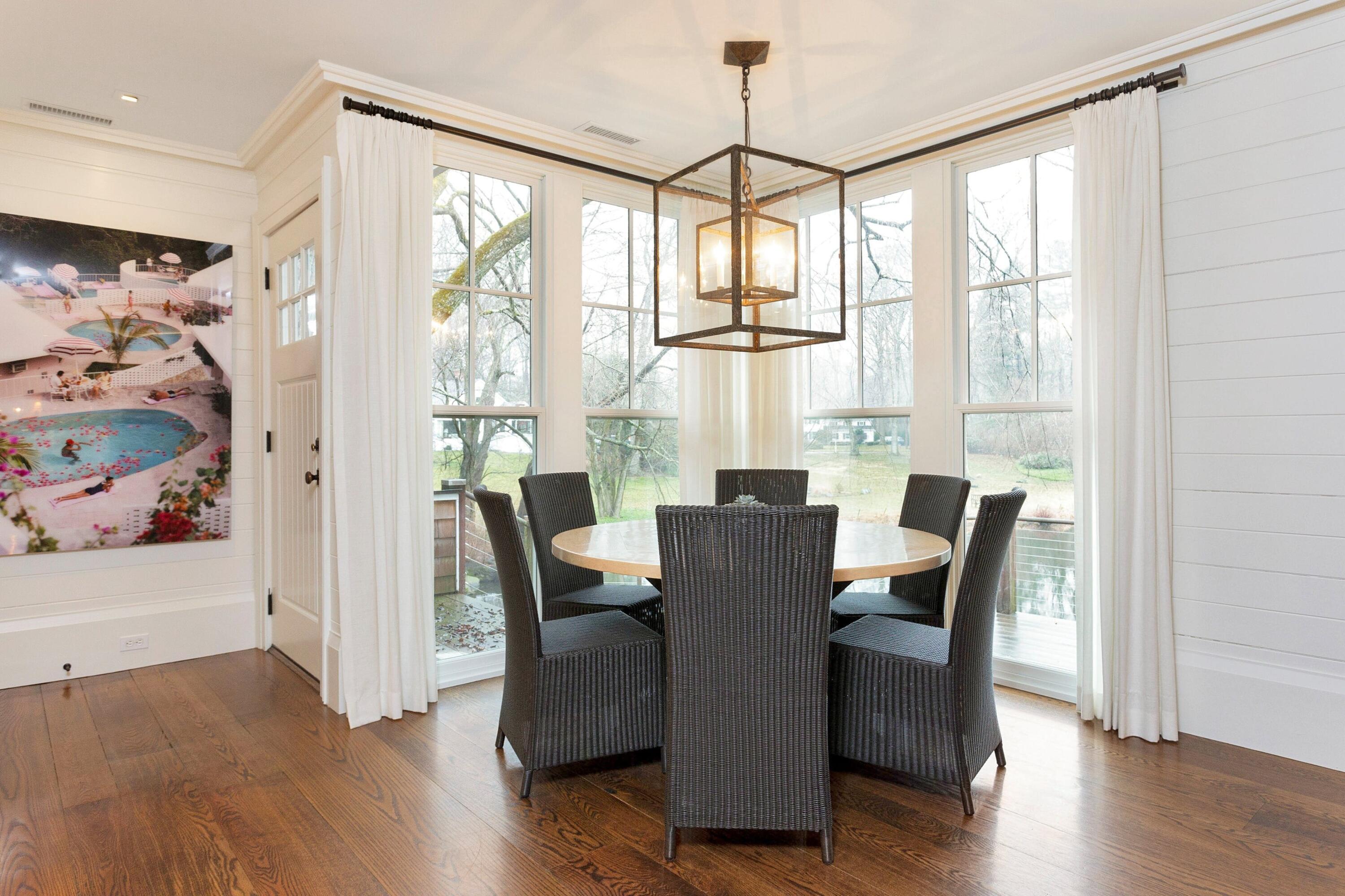20 Driftway Lane Darien, CT 06820 - Photo 22 of 76 a view of a dining room with furniture window and wooden floor