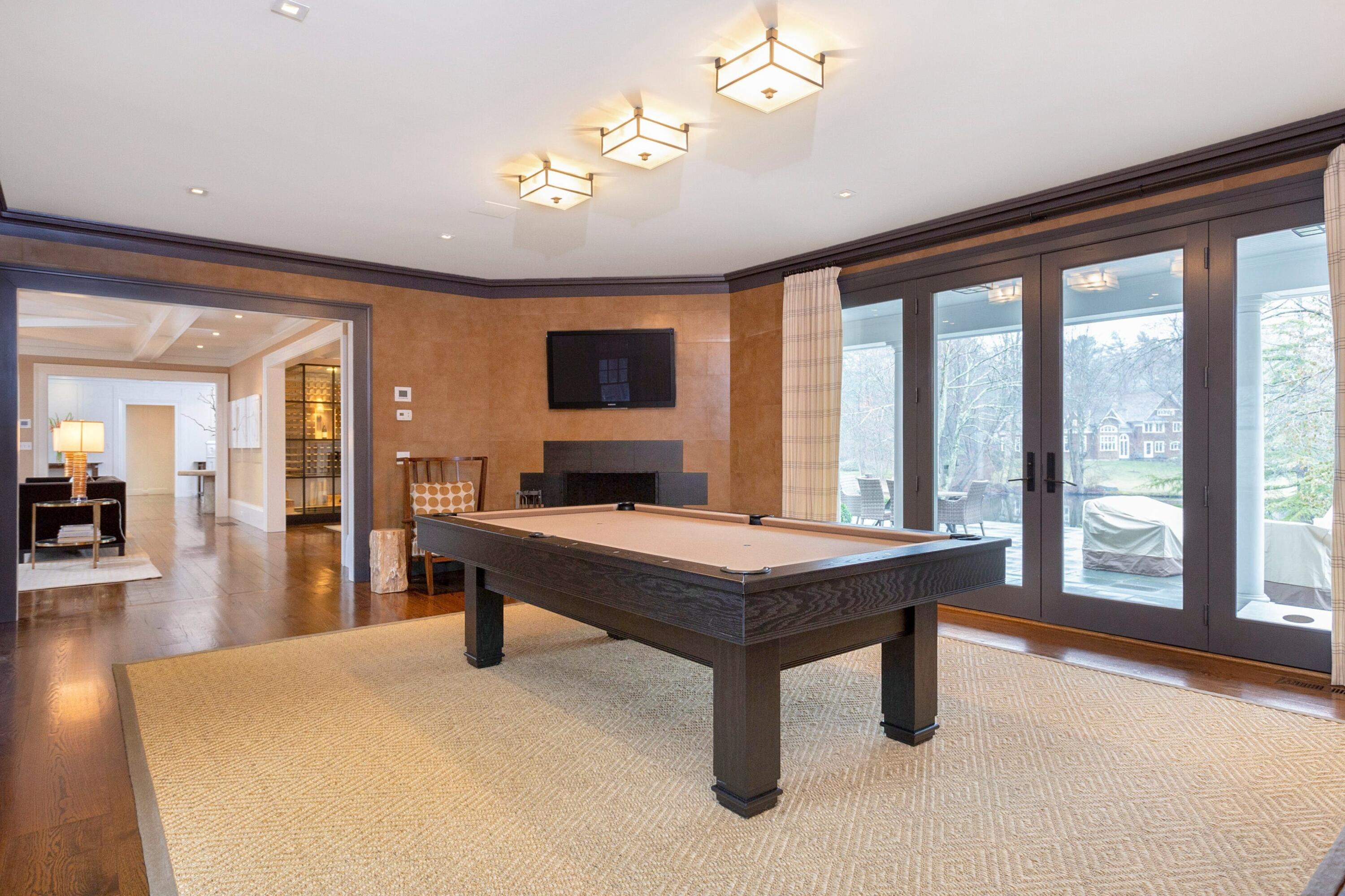 20 Driftway Lane Darien, CT 06820 - Photo 24 of 76 a room with furniture pool table flat screen tv and a large window