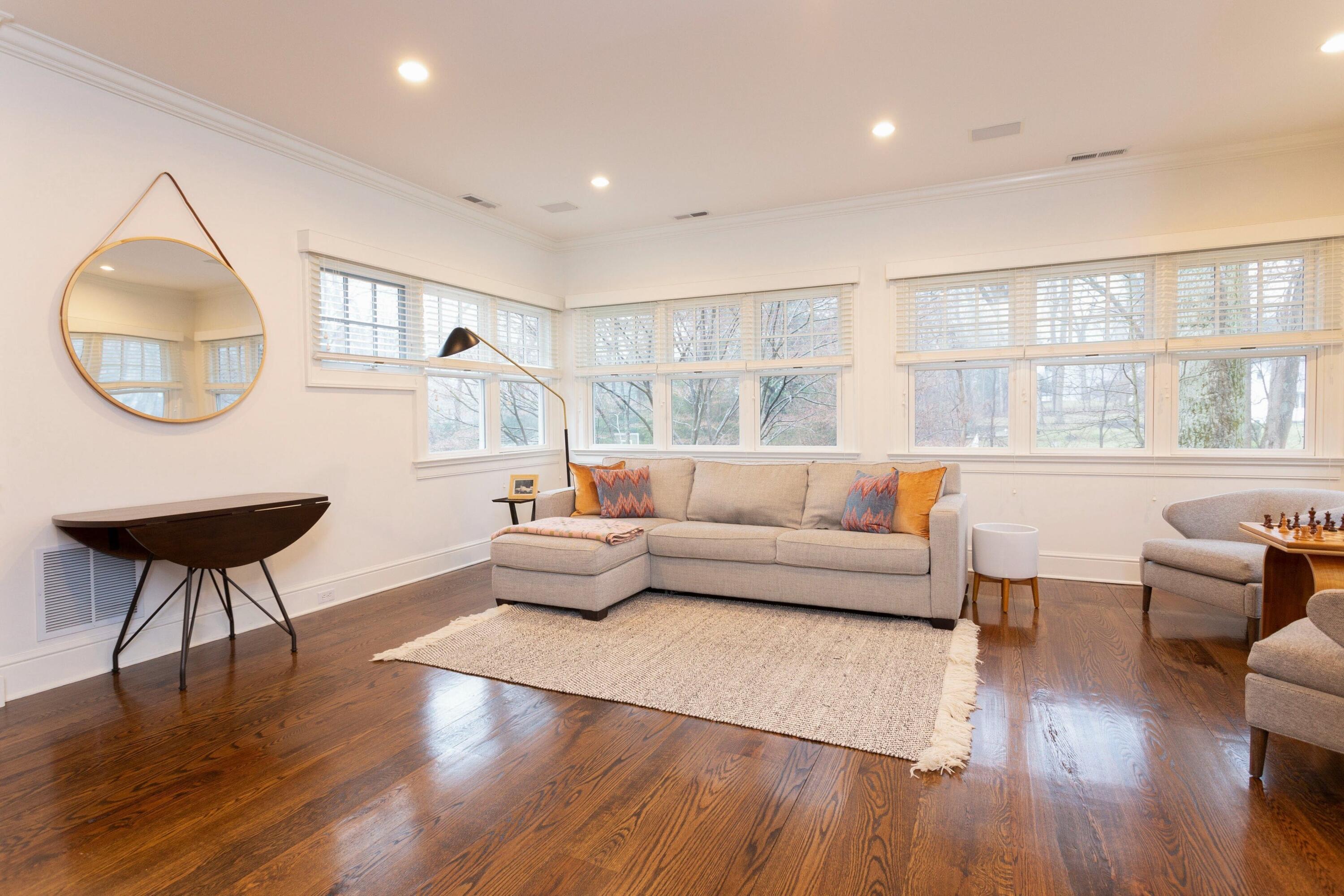 20 Driftway Lane Darien, CT 06820 - Photo 30 of 76 a living room with furniture a window and a chandelier