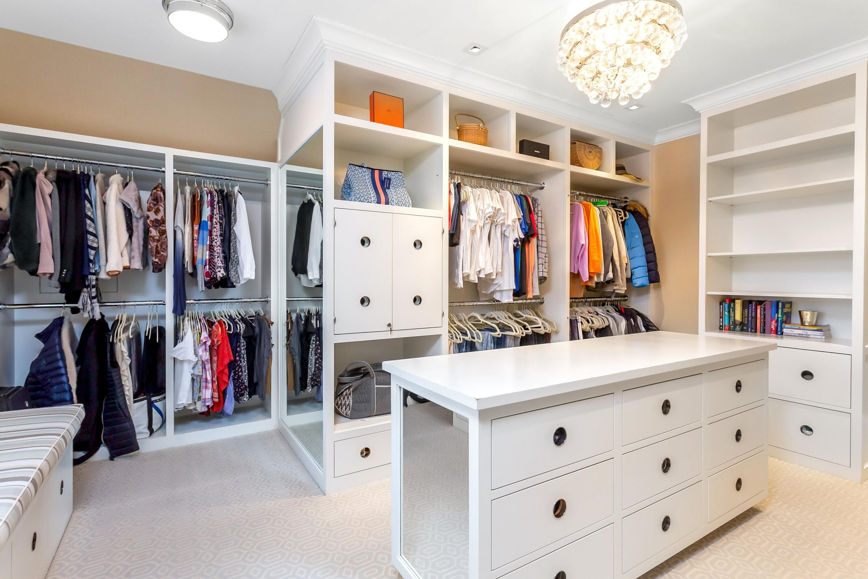 20 Driftway Lane Darien, CT 06820 - Photo 36 of 76 a view of walk in closet with clothes and shoes