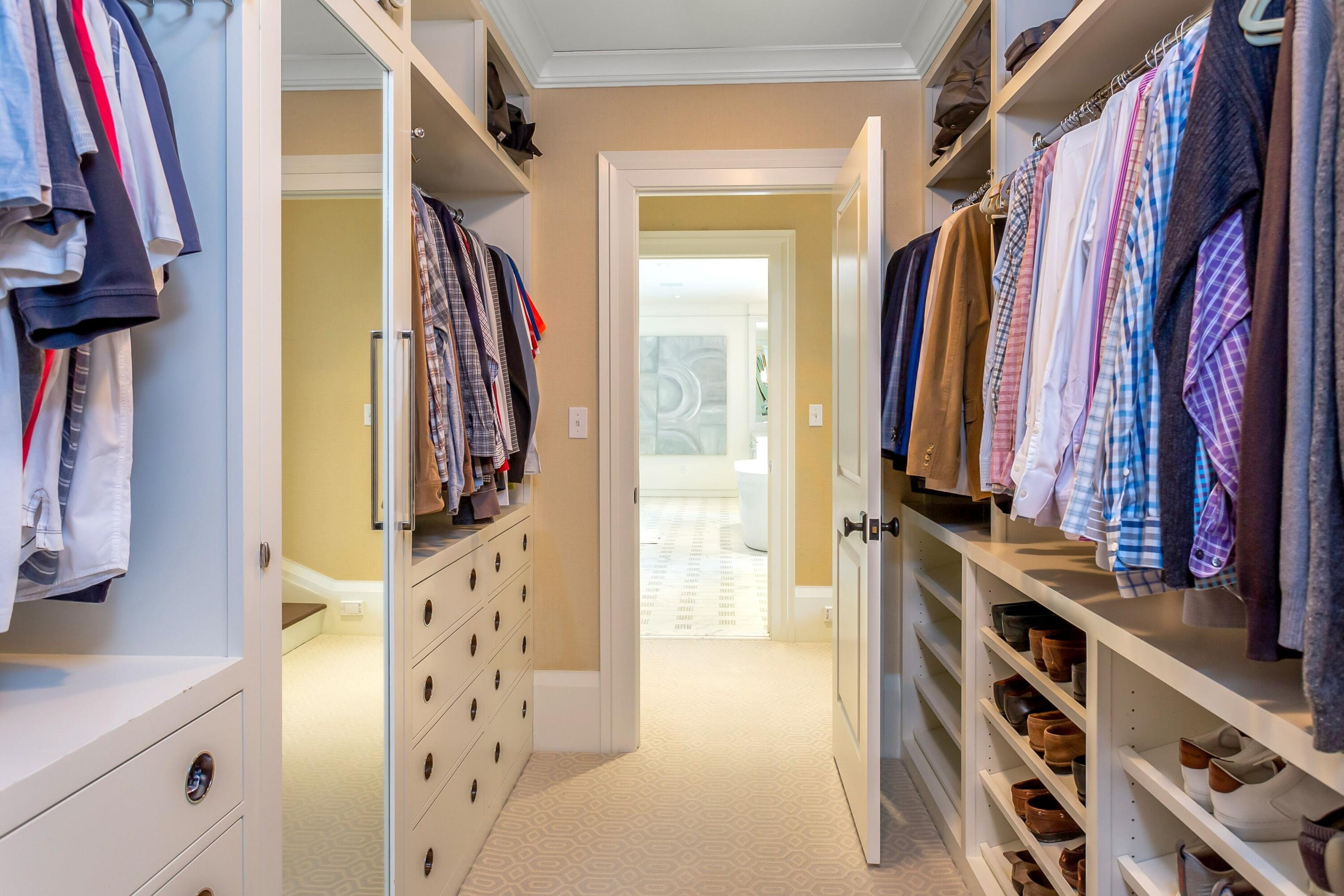 20 Driftway Lane Darien, CT 06820 - Photo 37 of 76 a view of walk in closet with clothes and shoes