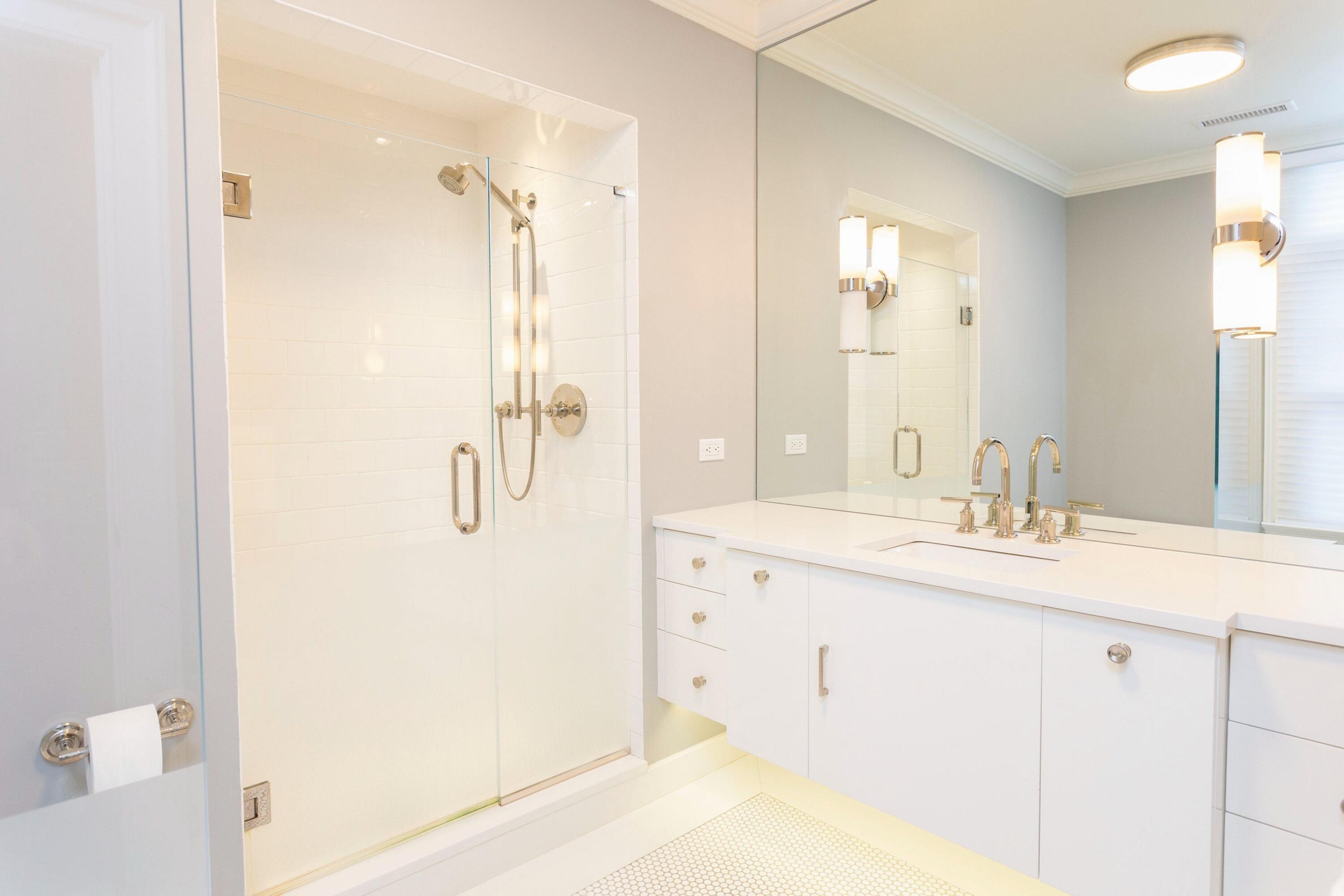 20 Driftway Lane Darien, CT 06820 - Photo 42 of 76 a bathroom with a shower sink and mirror