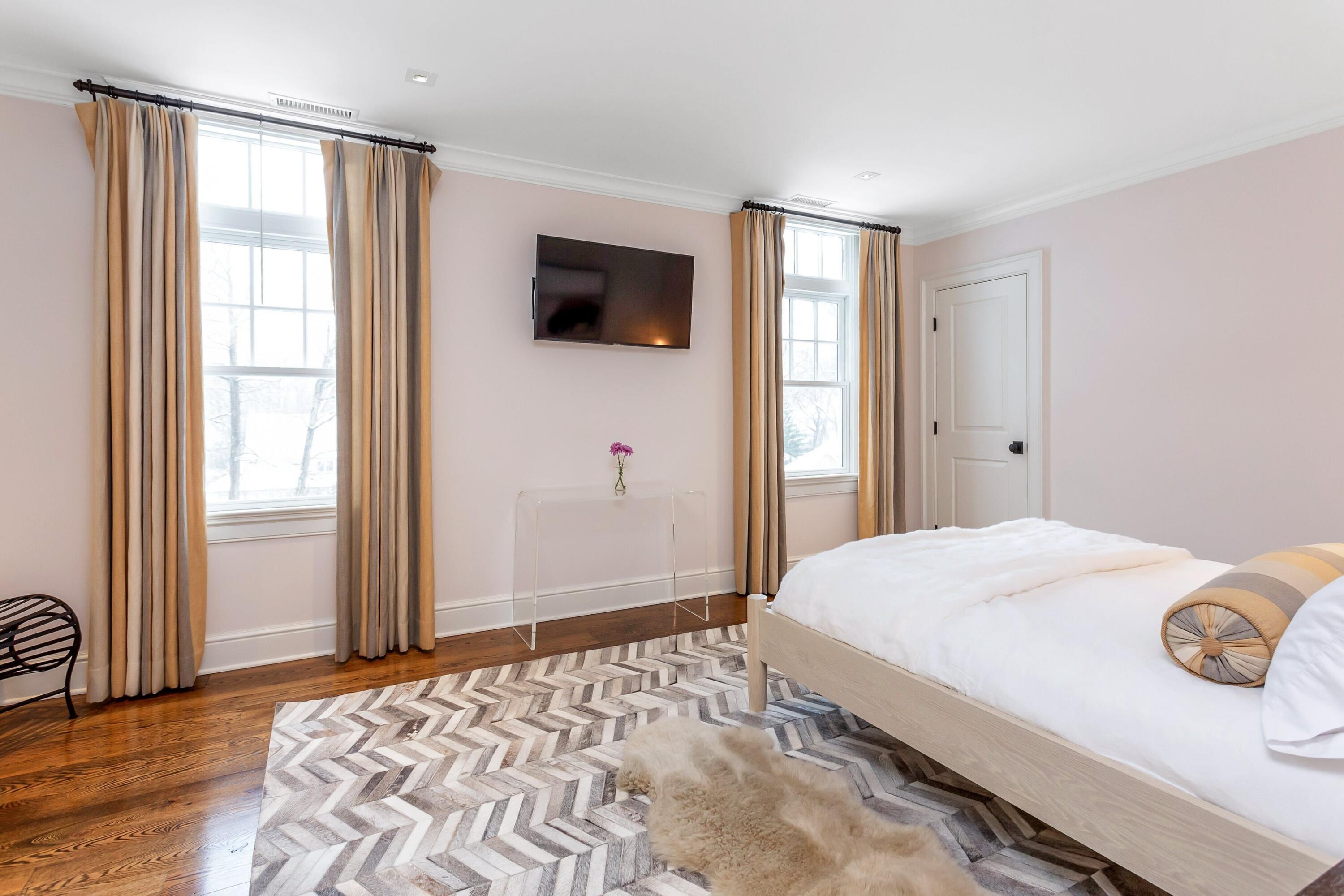 20 Driftway Lane Darien, CT 06820 - Photo 43 of 76 a bedroom with a bed and a flat screen tv