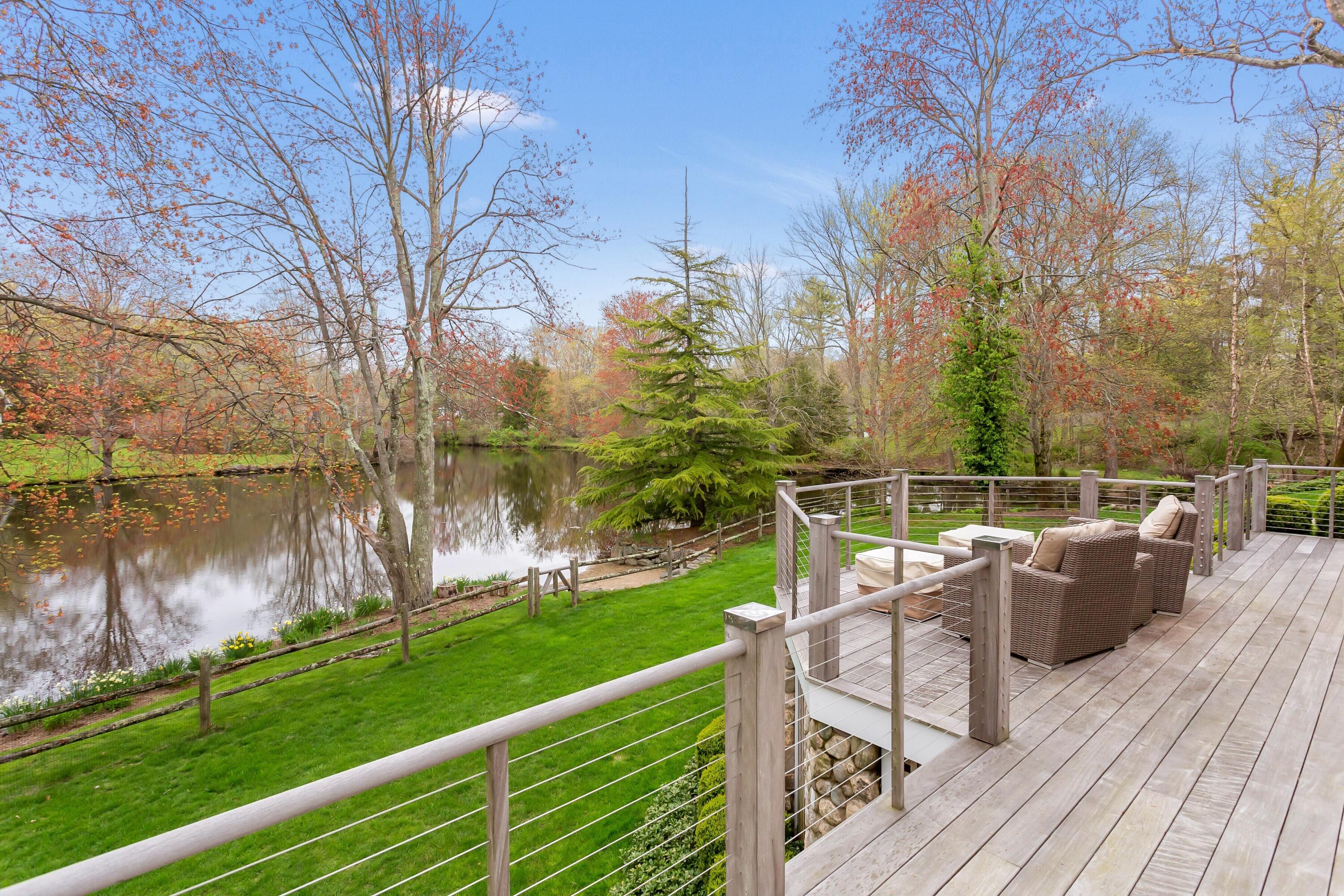 20 Driftway Lane Darien, CT 06820 - Photo 56 of 76 a view of a deck with couches and wooden floor