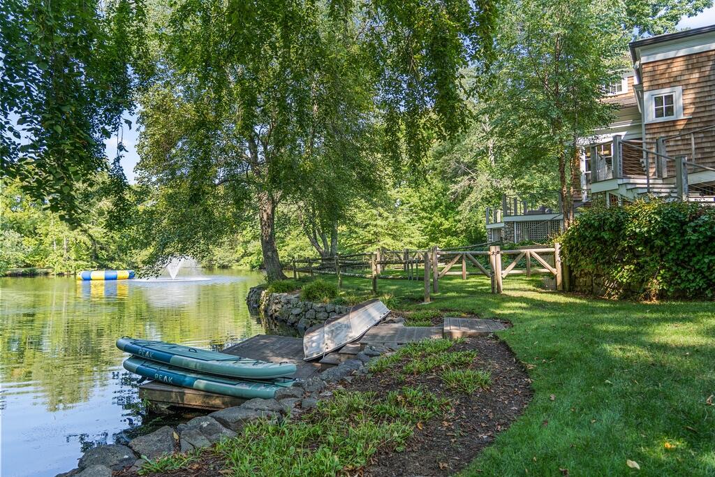 20 Driftway Lane Darien, CT 06820 - Photo 59 of 76 a view of a garden with plants and a lake view