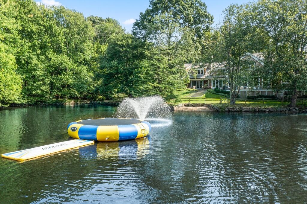 20 Driftway Lane Darien, CT 06820 - Photo 60 of 76 a view of a lake with trees