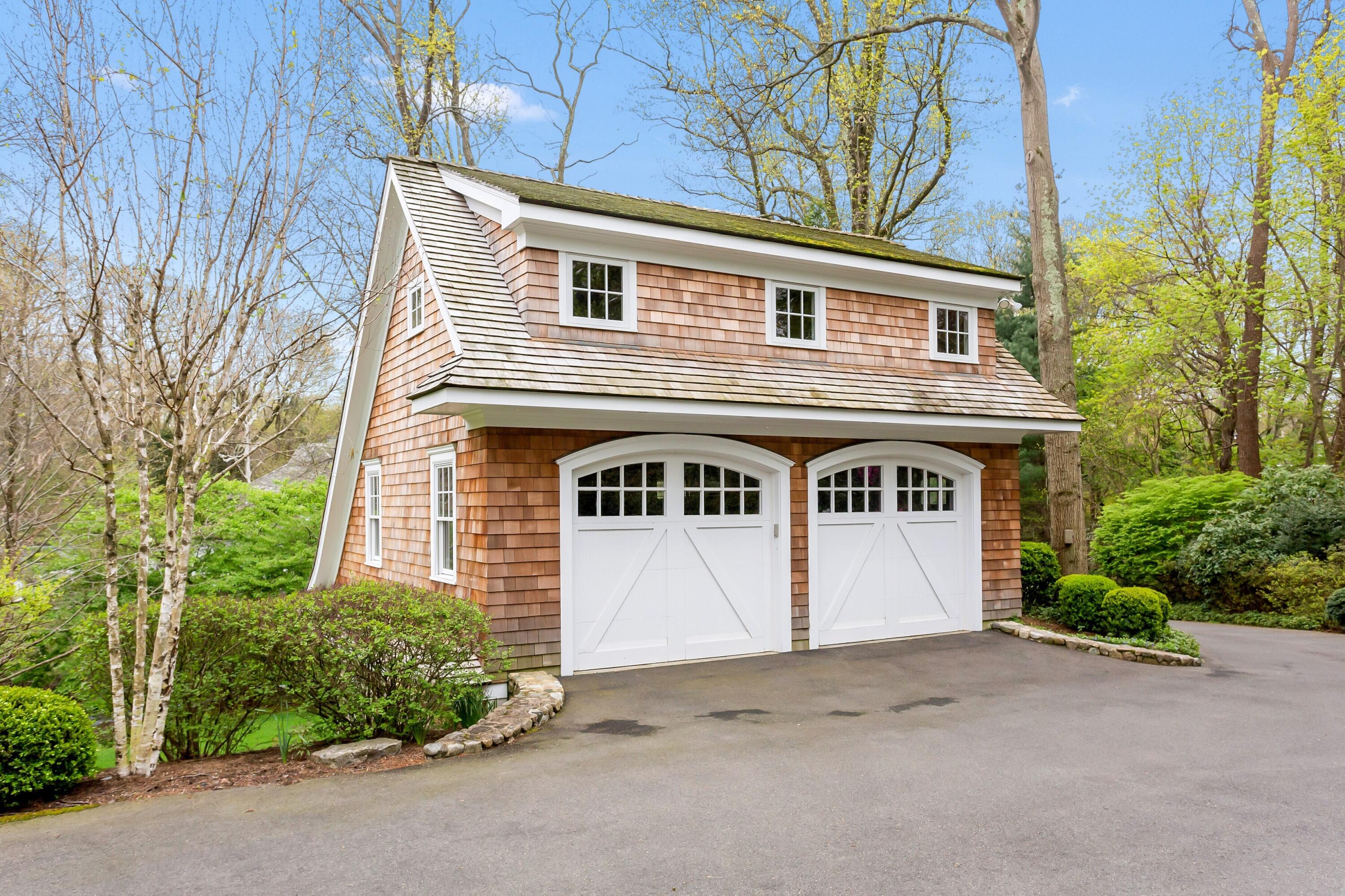 20 Driftway Lane Darien, CT 06820 - Photo 66 of 76 a front view of a house with a garage