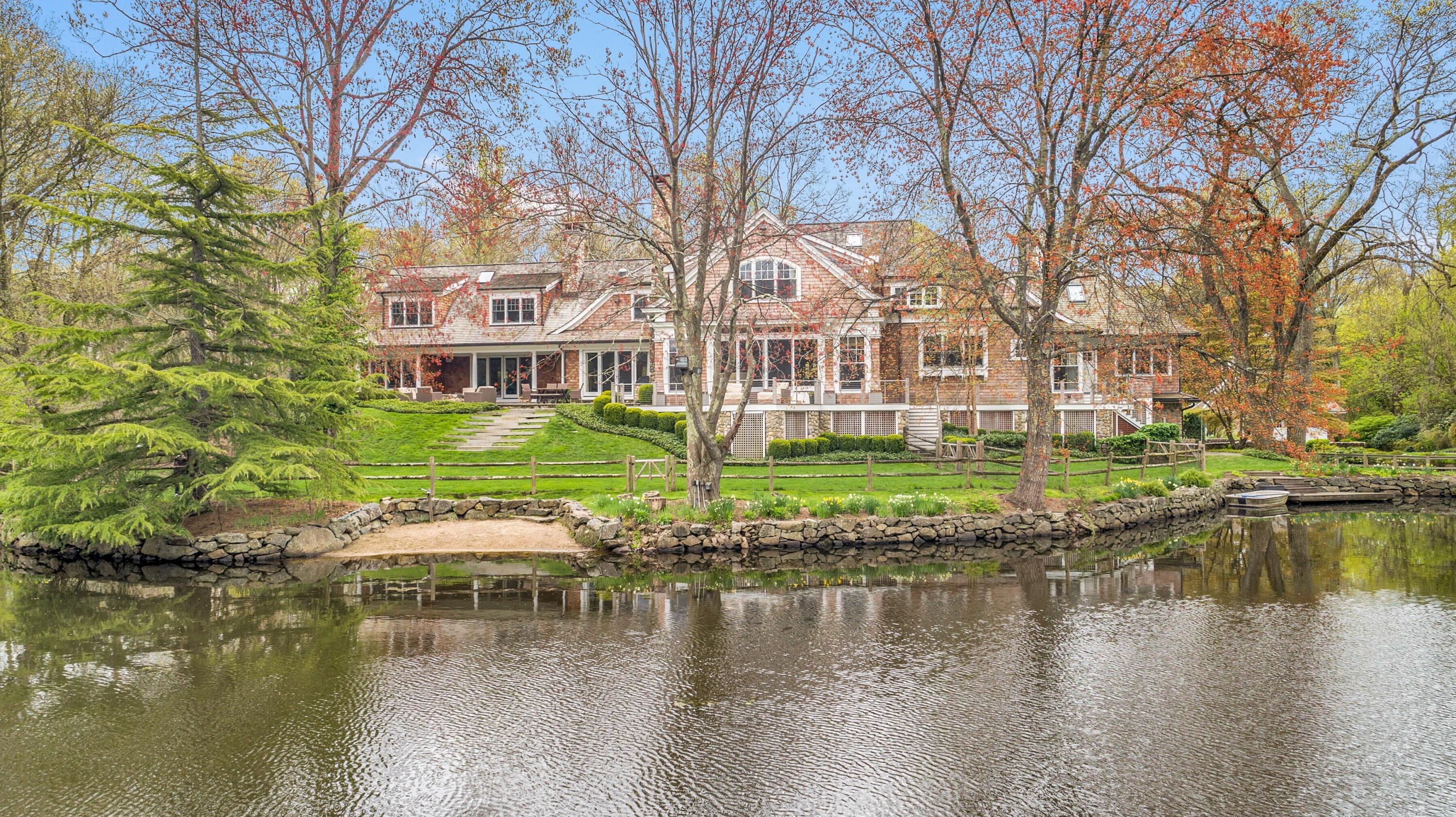 20 Driftway Lane Darien, CT 06820 - Photo 70 of 76 a view of residential houses with yard and lake view