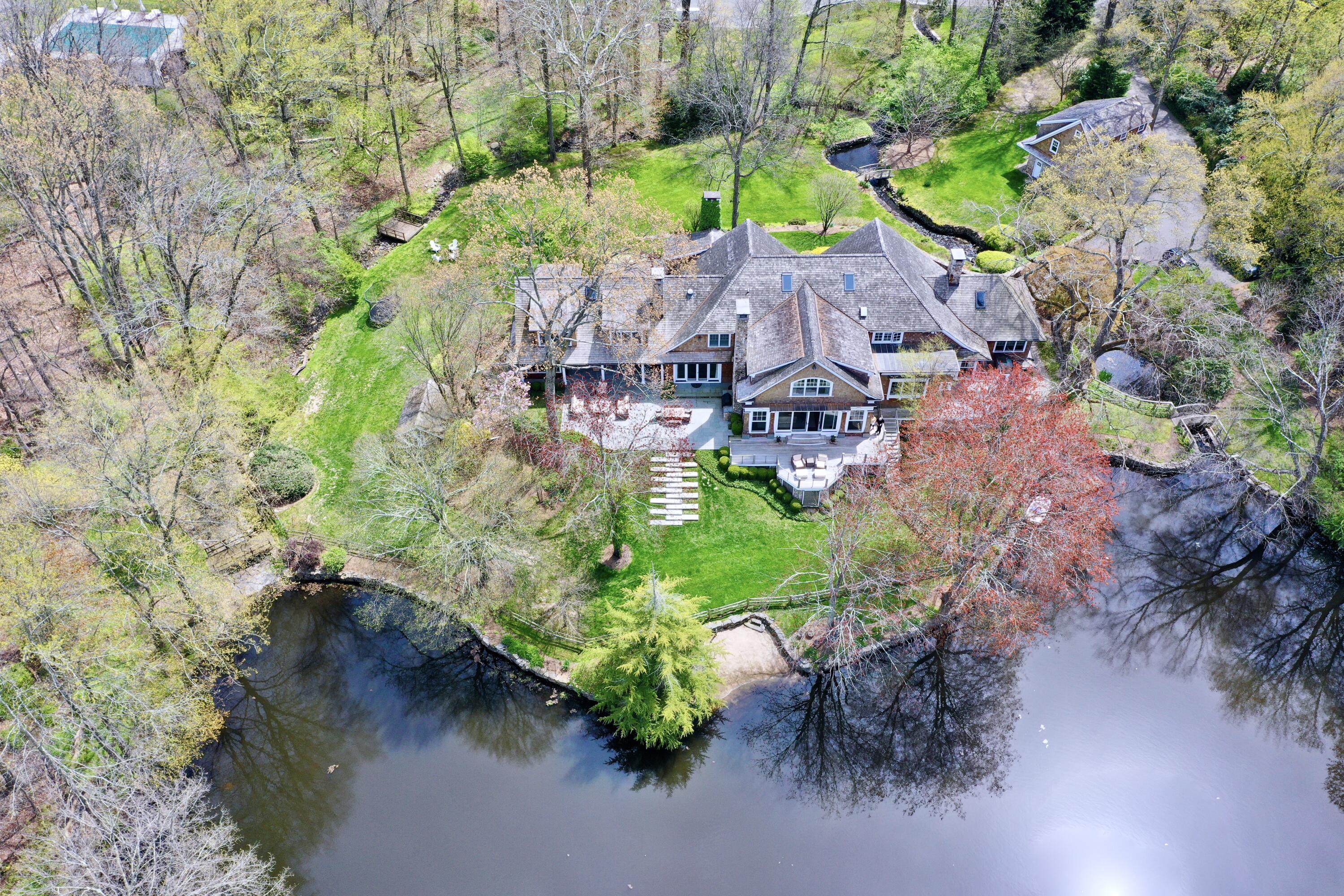 20 Driftway Lane Darien, CT 06820 - Photo 71 of 76 an aerial view of a house with a garden and lake view