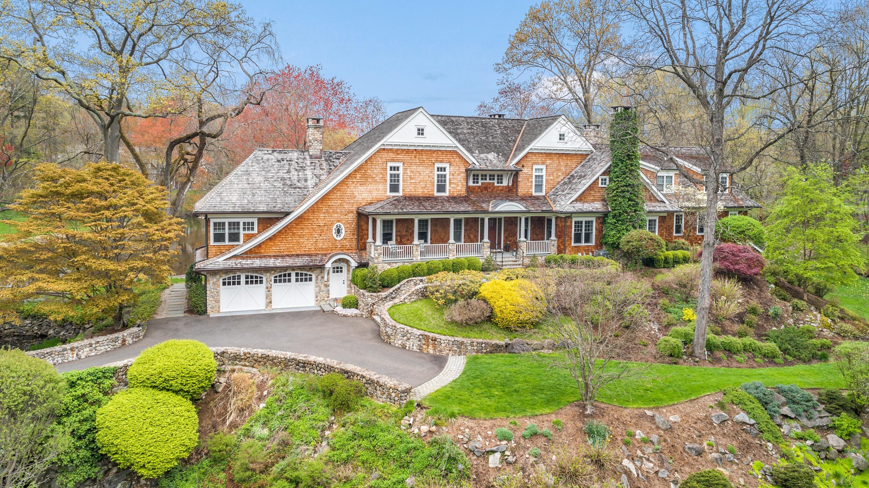 20 Driftway Lane Darien, CT 06820 - Photo 72 of 76 a view of a house with a swimming pool