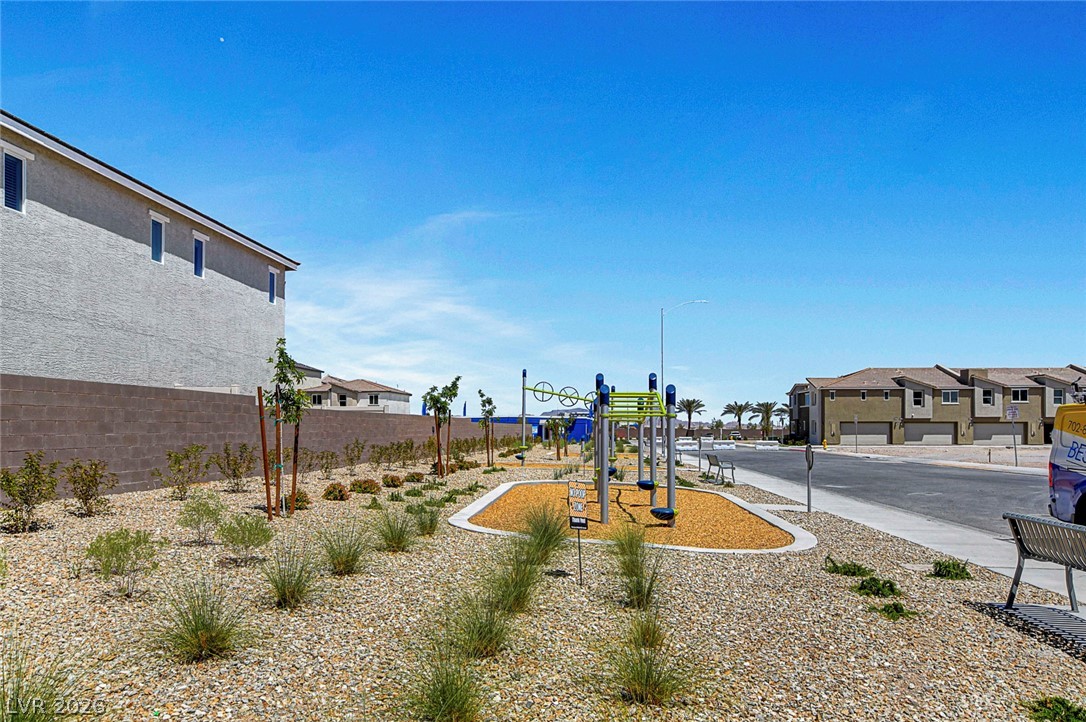 6924 Spicy Merlot Street North Las Vegas, NV 89086 - Photo 53 of 83 A vibrant playground anchors this well-designed community space, inviting outdoor activity.