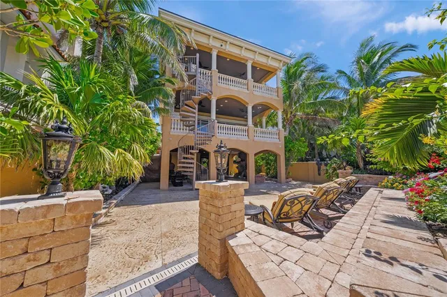 a living room with fireplace furniture and a flat screen tv