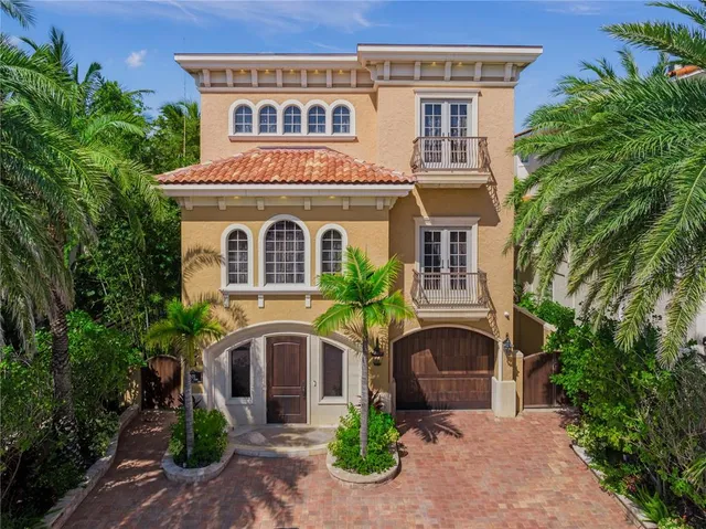 a view of a dining room with furniture and a chandelier