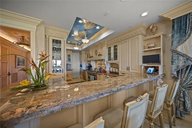 a bed room with a bed and a chandelier