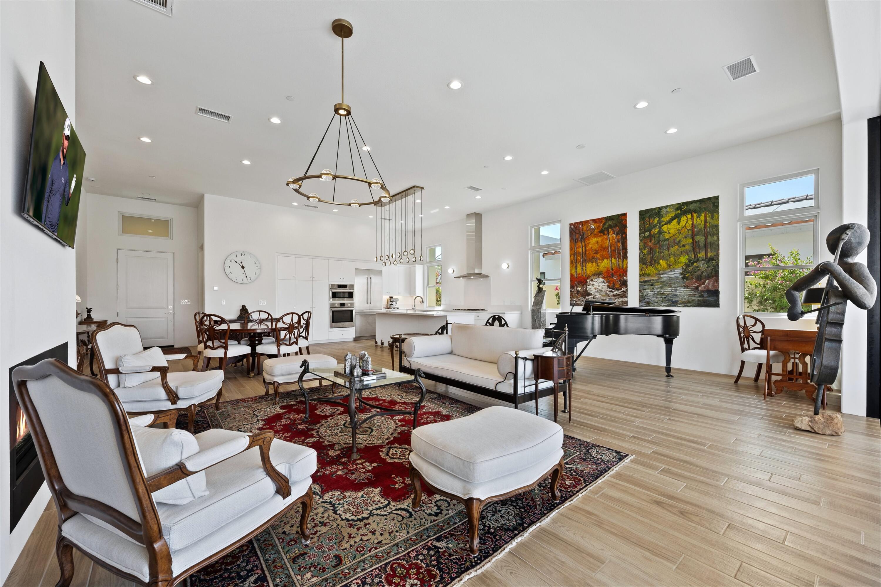 58892 Marbella La Quinta, CA 92253 - Photo 13 of 65 a living room with lots of furniture and a flat screen tv