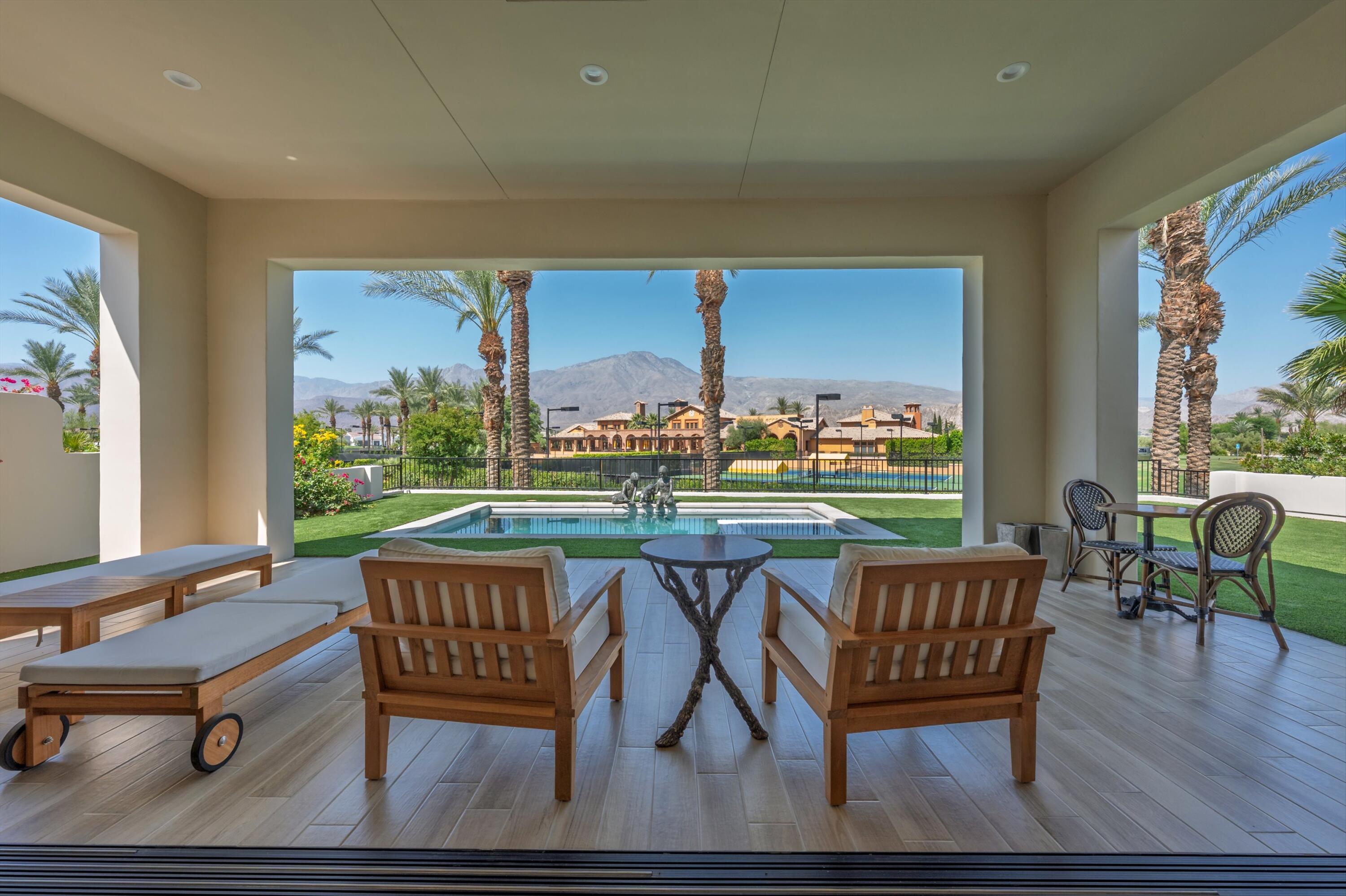 58892 Marbella La Quinta, CA 92253 - Photo 3 of 65 a view of a chairs and table in patio with a yard