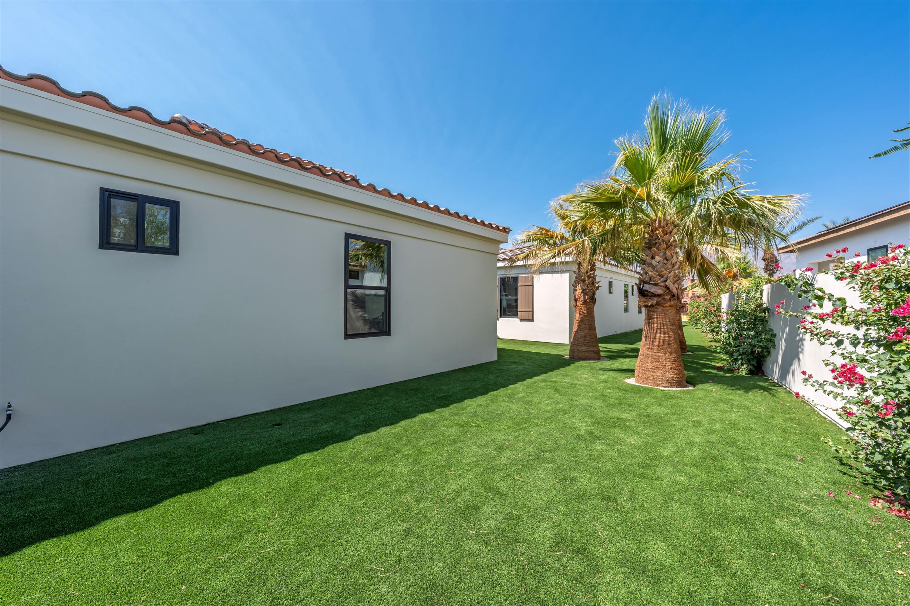 58892 Marbella La Quinta, CA 92253 - Photo 37 of 65 a house view with a garden space
