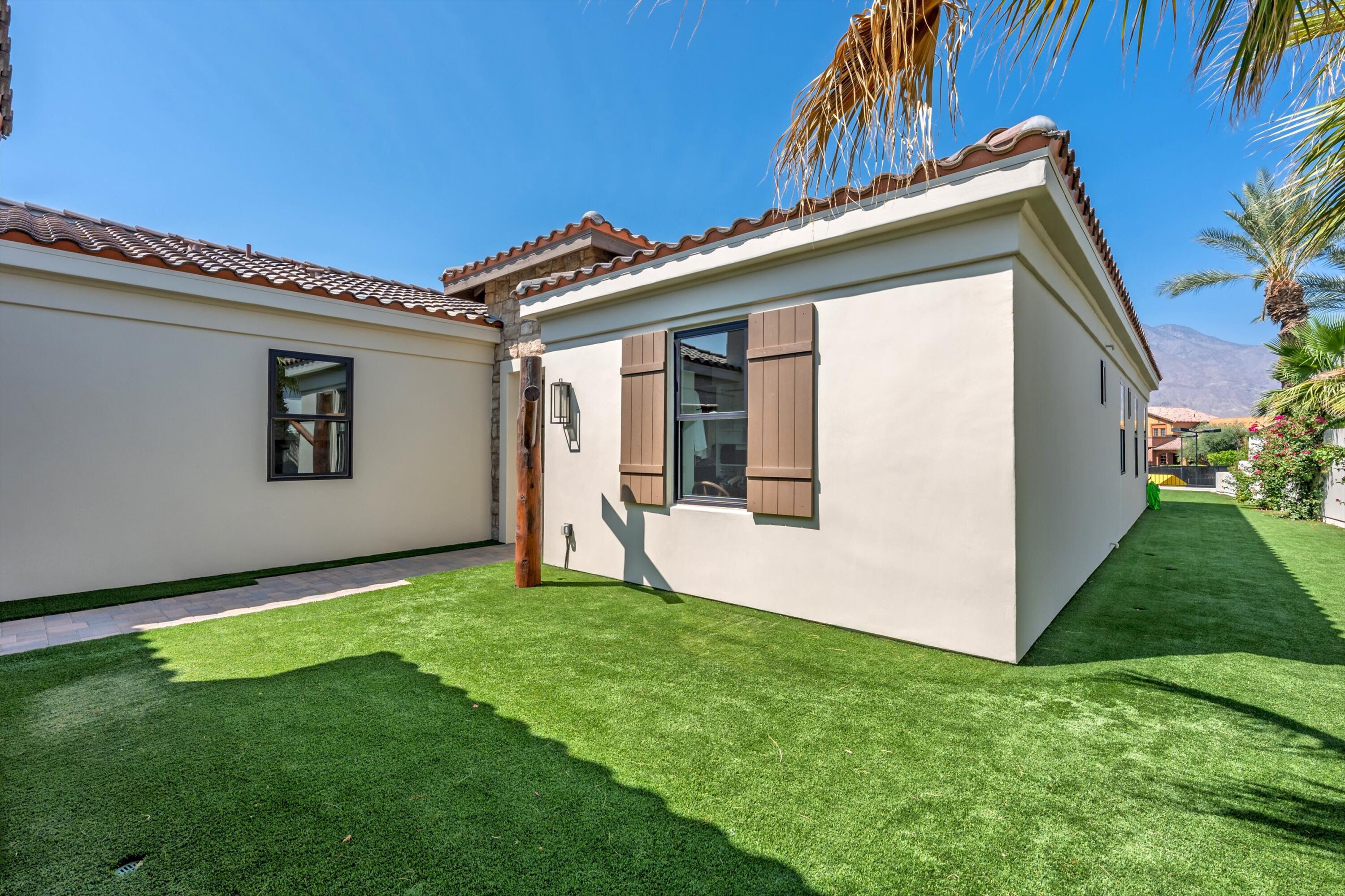 58892 Marbella La Quinta, CA 92253 - Photo 38 of 65 a view of a house with a yard