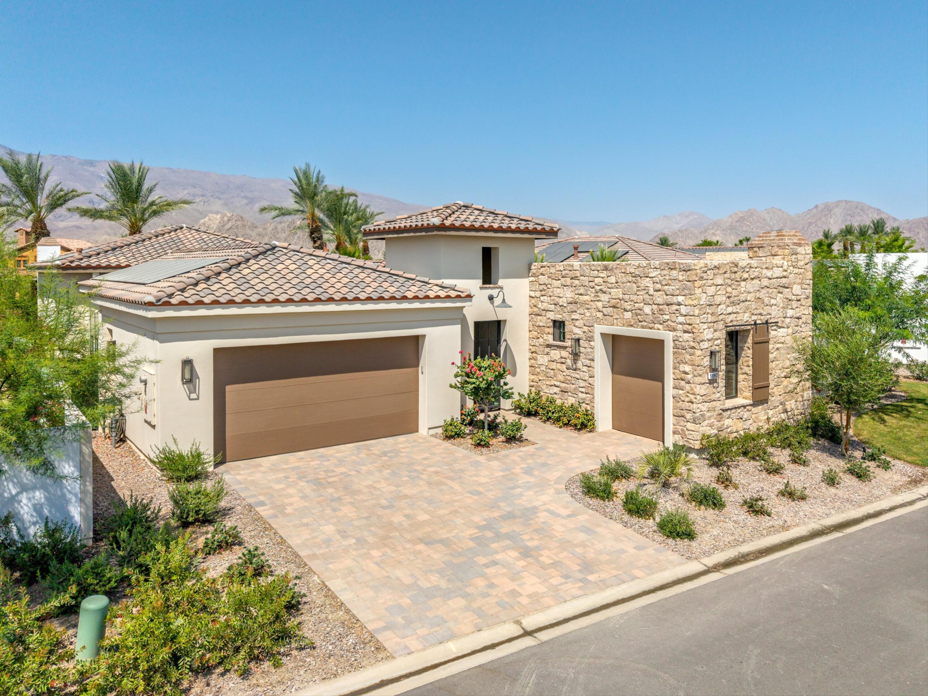 58892 Marbella La Quinta, CA 92253 - Photo 40 of 65 front view of a house with a yard