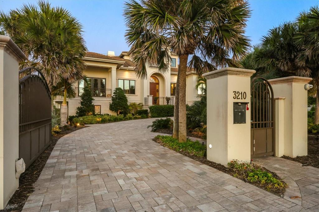 3210 Casey Key Road Nokomis, FL 34275 - Photo 3 of 77 a front view of a house with a yard