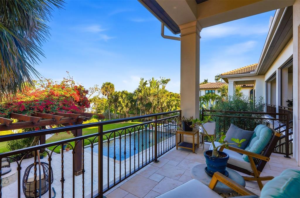 3210 Casey Key Road Nokomis, FL 34275 - Photo 39 of 77 a view of a chairs and table in the balcony