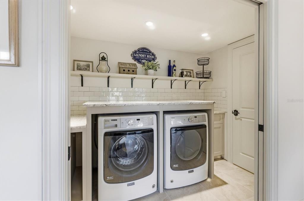 3210 Casey Key Road Nokomis, FL 34275 - Photo 54 of 77 a utility room with a sink dryer and washer