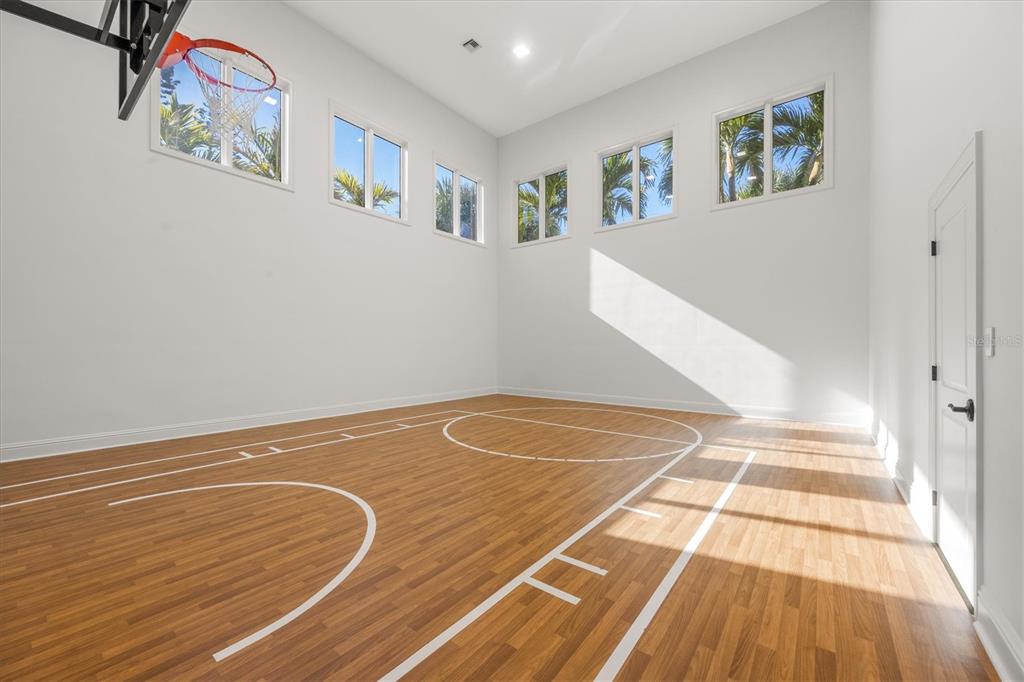 3210 Casey Key Road Nokomis, FL 34275 - Photo 57 of 77 a view of a room with wooden floor and staircase