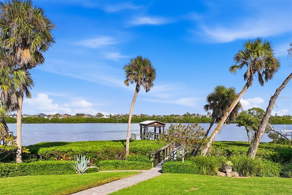 3210 Casey Key Road Nokomis, FL 34275 - Photo 68 of 77 a view of a garden with a building in the background