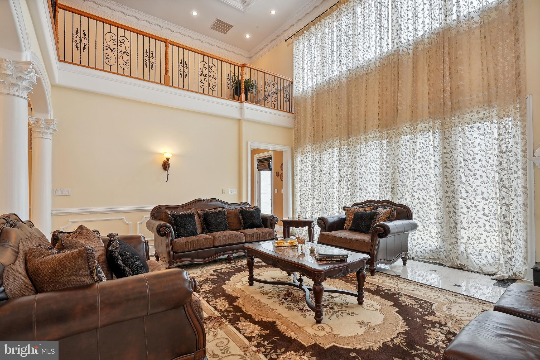 11704 Centurion Way Potomac, MD 20854 - Photo 21 of 93 Great Room with Two Story Windows