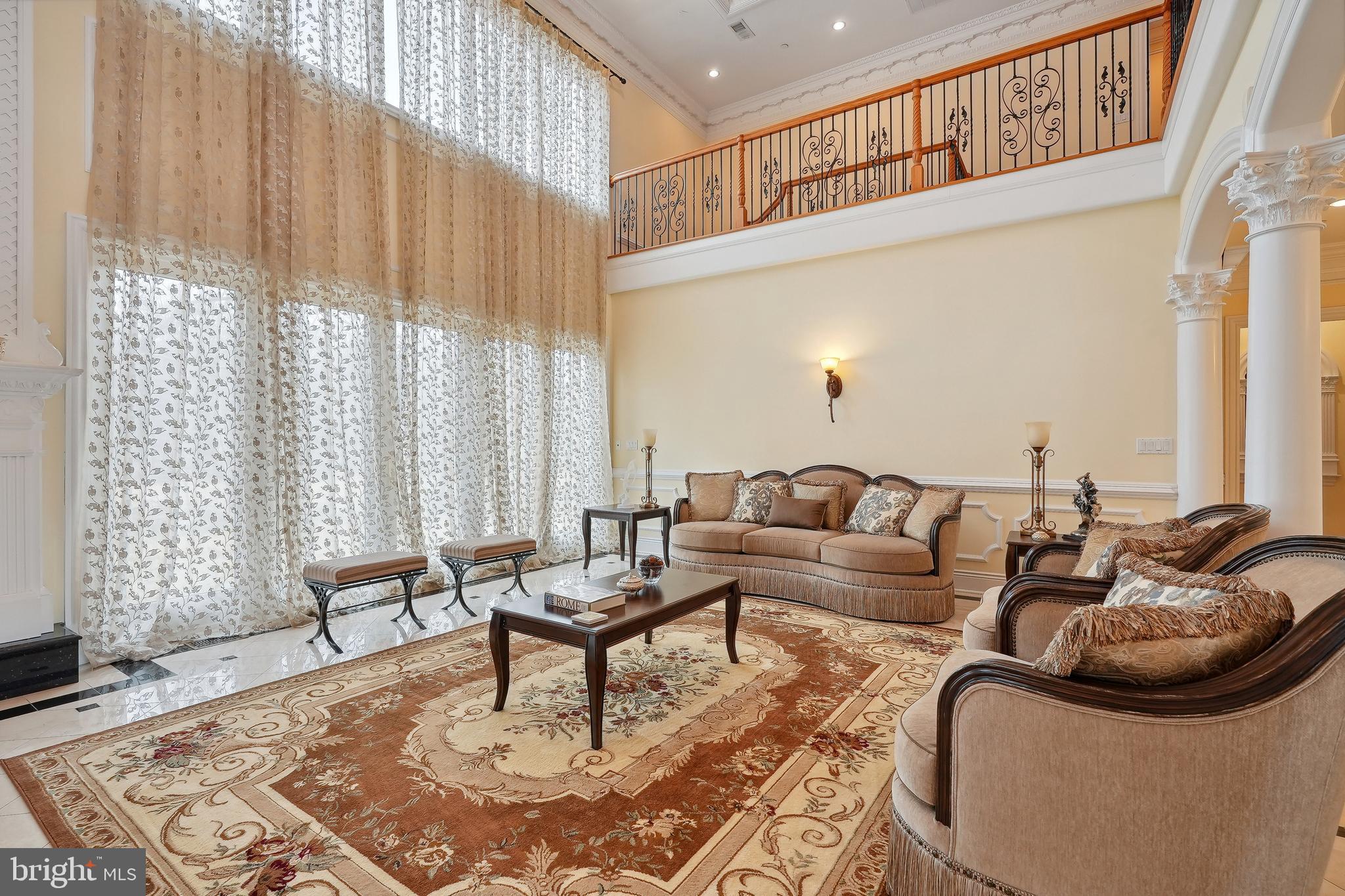 11704 Centurion Way Potomac, MD 20854 - Photo 22 of 93 Great Room with Two Story Windows