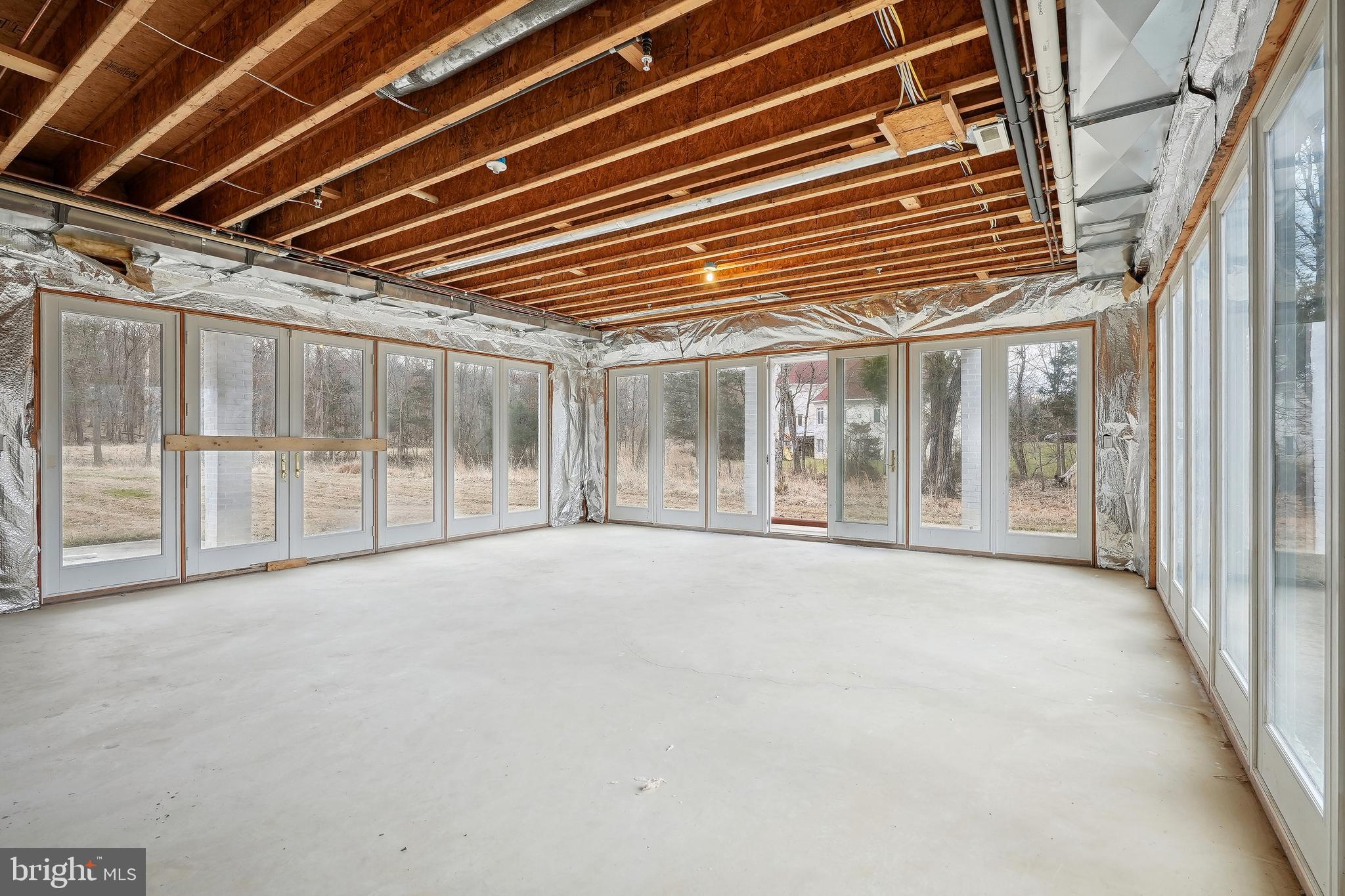 11704 Centurion Way Potomac, MD 20854 - Photo 78 of 93 Unfinished Basement with Floor to Ceiling Windows