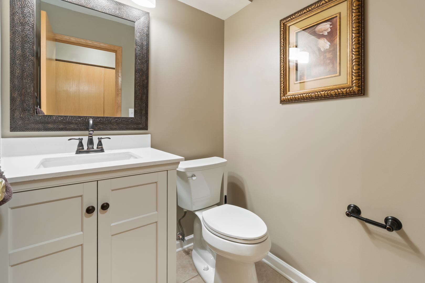 1985 Rochelle Court Wheeling, IL 60090 - Photo 23 of 38 a bathroom with a toilet sink and mirror
