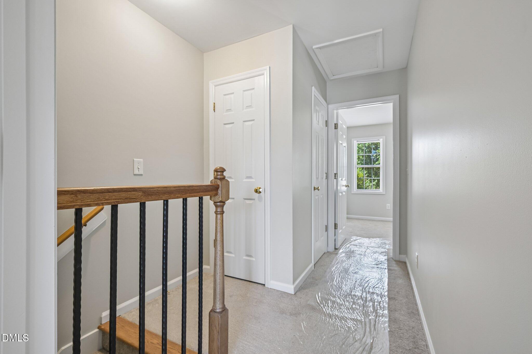 278 South Raleigh Street Angier, NC 27501 - Photo 17 of 35 a view of a hallway with wooden floor and closet
