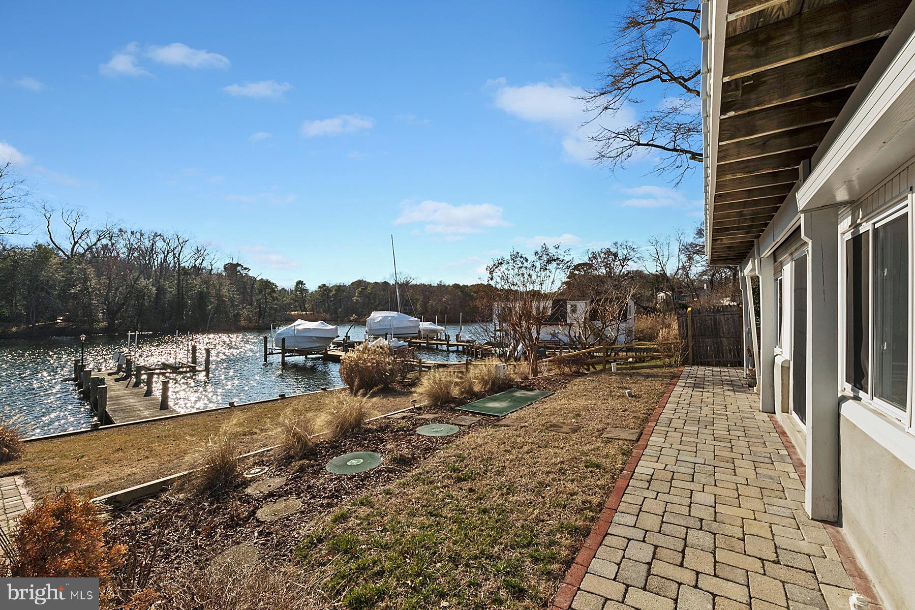 1253 Magothy Road Pasadena, MD 21122 - Photo 33 of 49 Outside the three-season room is a patio