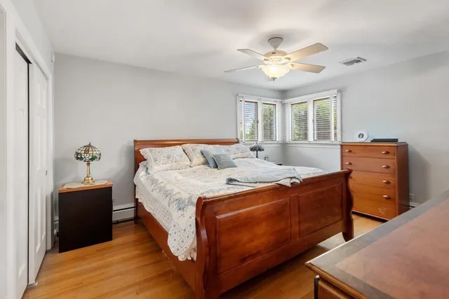 a bed room with a bed and a chandelier