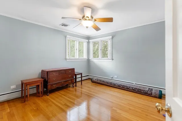 a room with furniture pool table and a ceiling fan