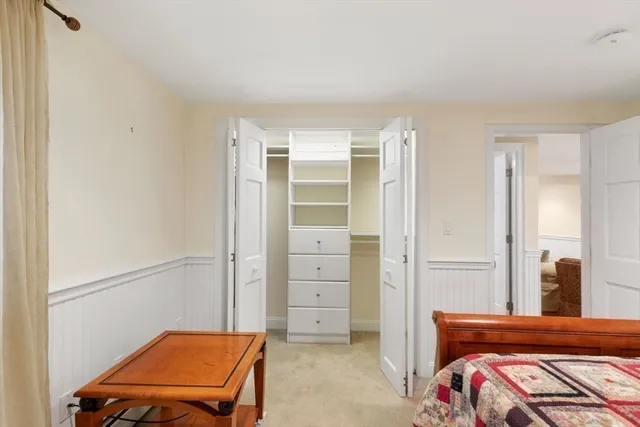 a livingroom with workspace and a window
