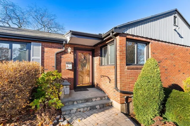 a front view of a house with garden