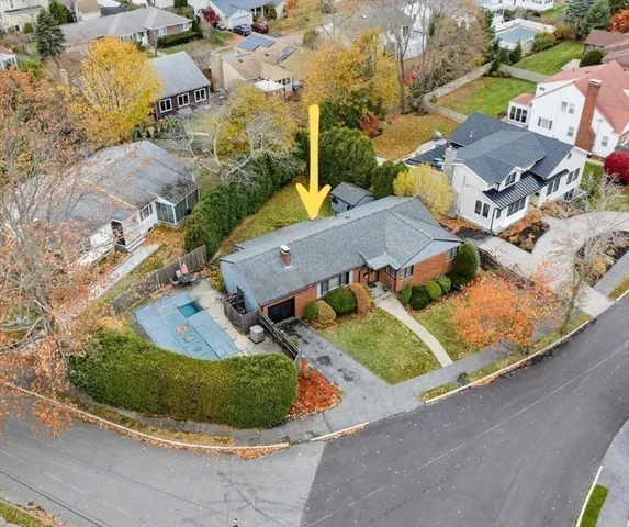 an aerial view of residential houses with outdoor space